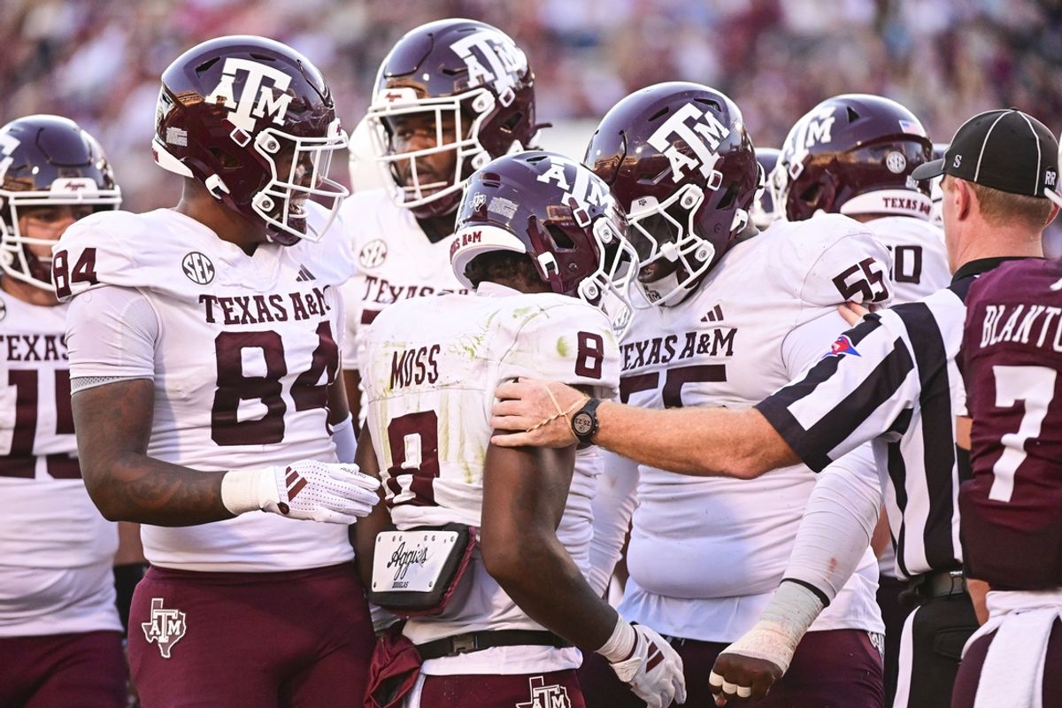 Oct 19, 2024; Starkville, Mississippi, USA;  Texas A&M Aggies running back Le'Veon Moss (8) reacts with teammates after a touchdown against the Mississippi State Bulldogs during the third quarter at Davis Wade Stadium at Scott Field. Mandatory Credit: Matt Bush-Imagn Images