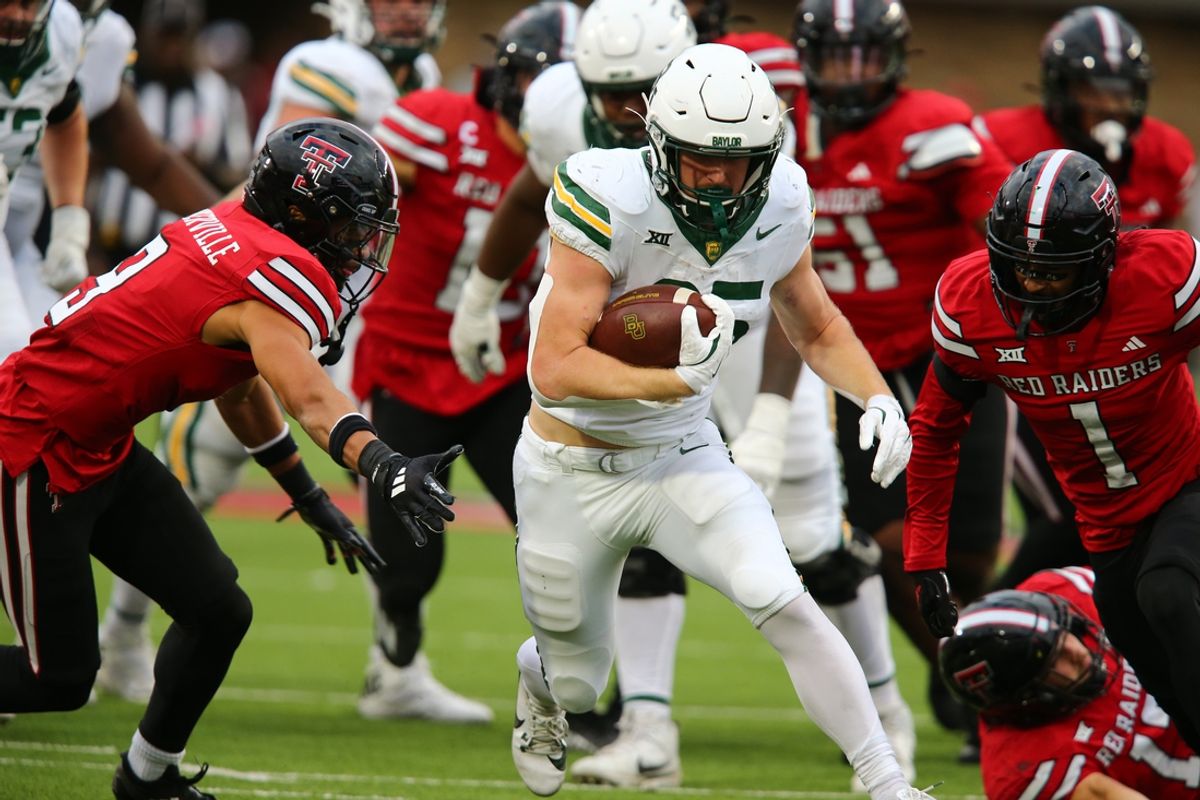 Oct 19, 2024; Lubbock, Texas, USA;  Baylor Bears running back Dawson Pendergrass (35) runs the ball against the Texas Tech Red Raiders in the second half at Jones AT&T Stadium and Cody Campbell Field. Mandatory Credit: Michael C. Johnson-Imagn Images