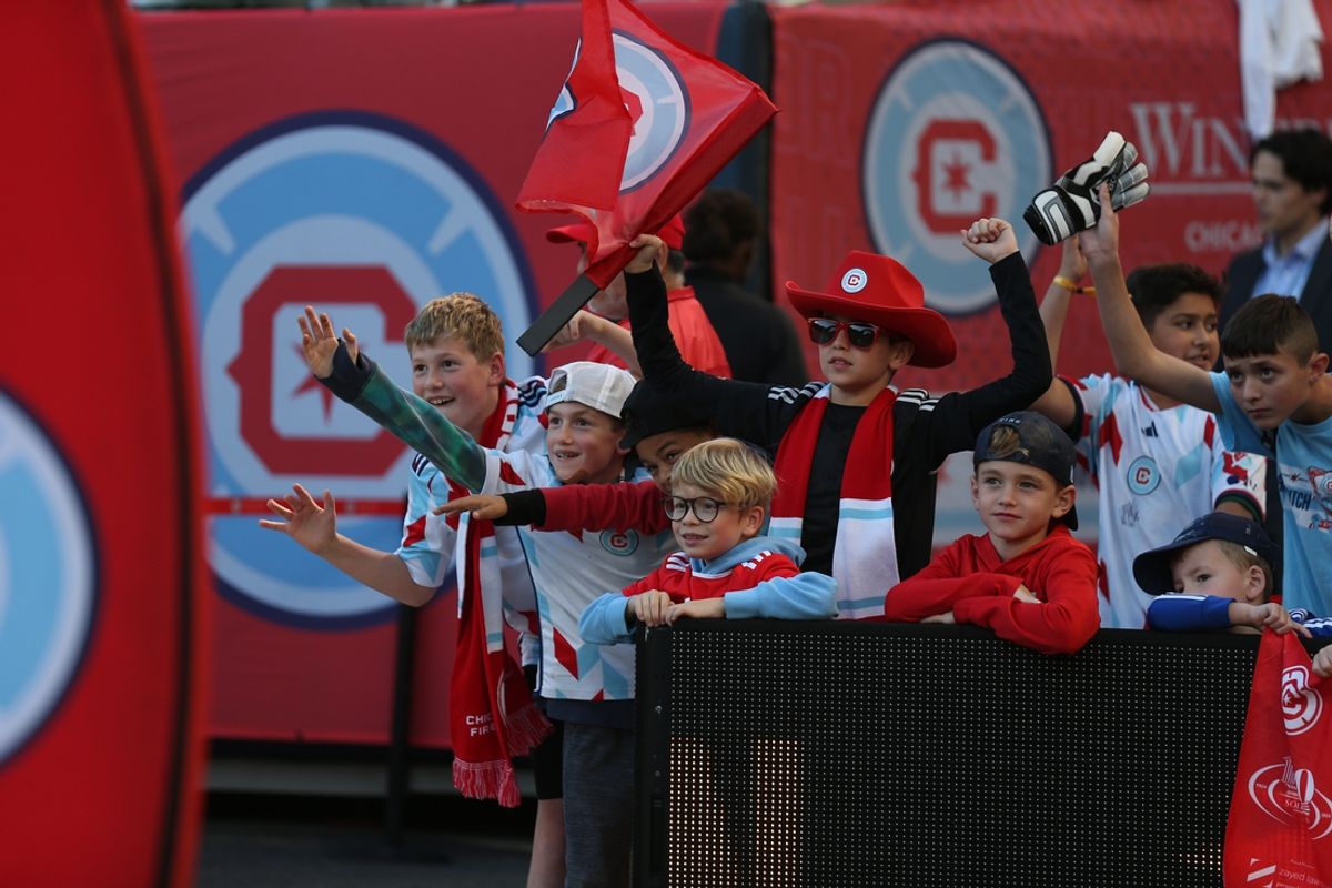 Oct 19, 2024; Chicago, Illinois, USA; Chicago Fire FC fans cheer prior to a match against Nashville SC at Soldier Field. Mandatory Credit: Talia Sprague-Imagn Images
