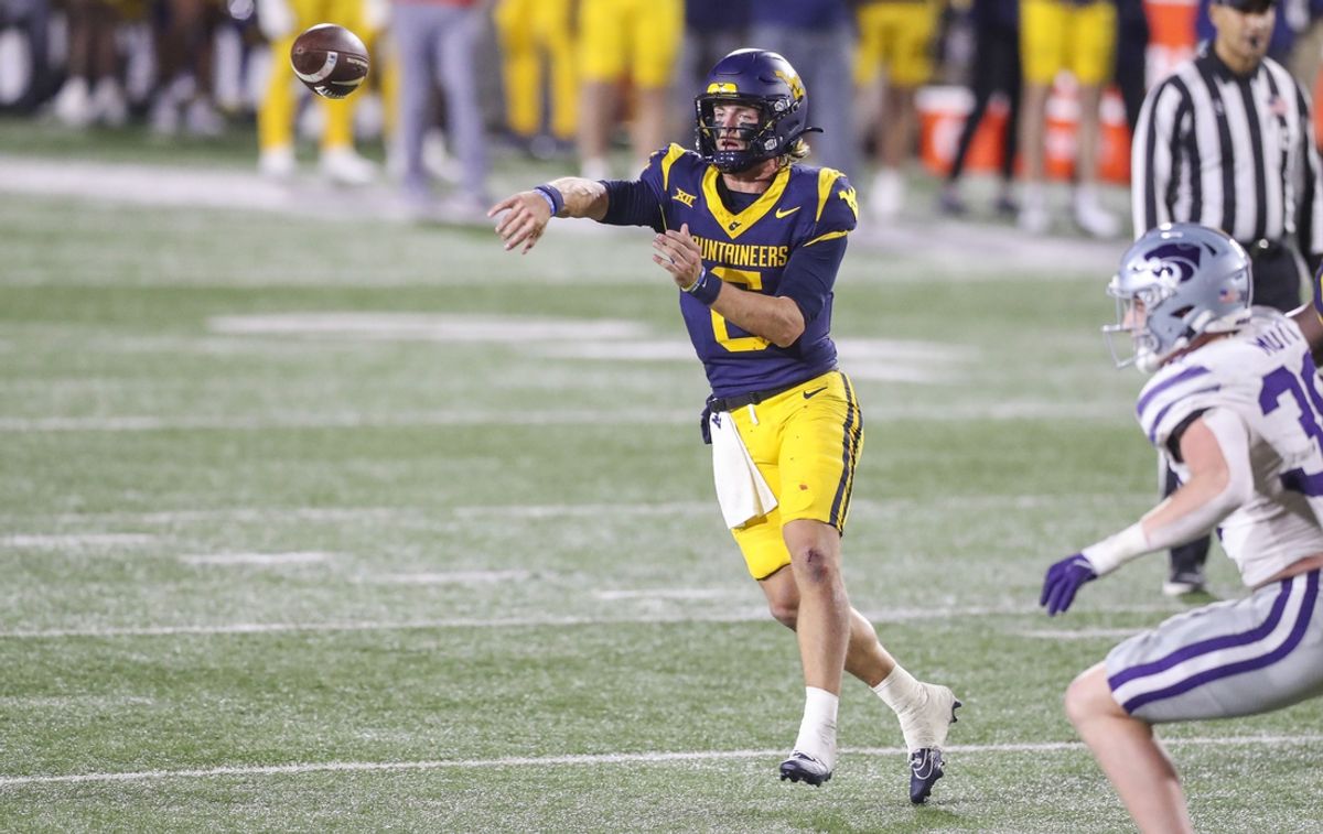 Oct 19, 2024; Morgantown, West Virginia, USA; West Virginia Mountaineers quarterback Garrett Greene (6) throws during the second quarter against the Kansas State Wildcats at Mountaineer Field at Milan Puskar Stadium. Mandatory Credit: Ben Queen-Imagn Images