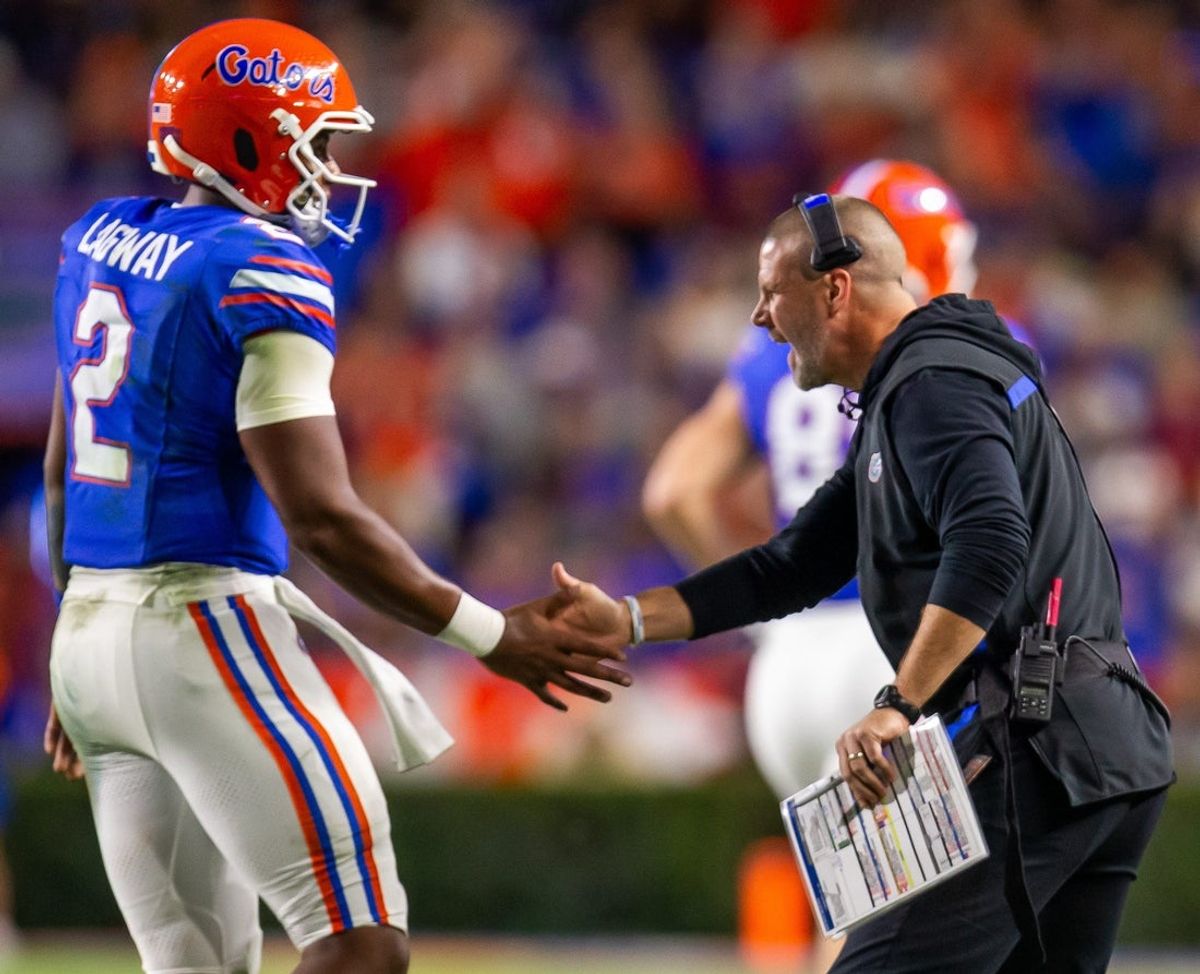 Florida Gators quarterback DJ Lagway (2) is congratulated by Florida Gators head coach Billy Napier after a series during the first half at Ben Hill Griffin Stadium in Gainesville, FL on Saturday, October 19, 2024 against the Kentucky Wildcats. [Doug Engle/Gainesville Sun]