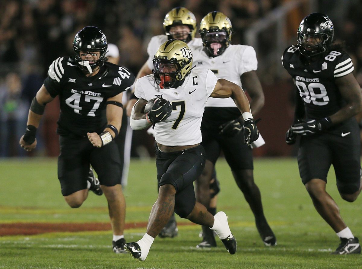 UCF Knights running back RJ Harvey (7) runs with the ball for a first down against Iowa State during the first quarter in the week-8 NCAA football at Jack Trice Stadium on Saturday, Oct. 19, 2024, in Ames, Iowa.