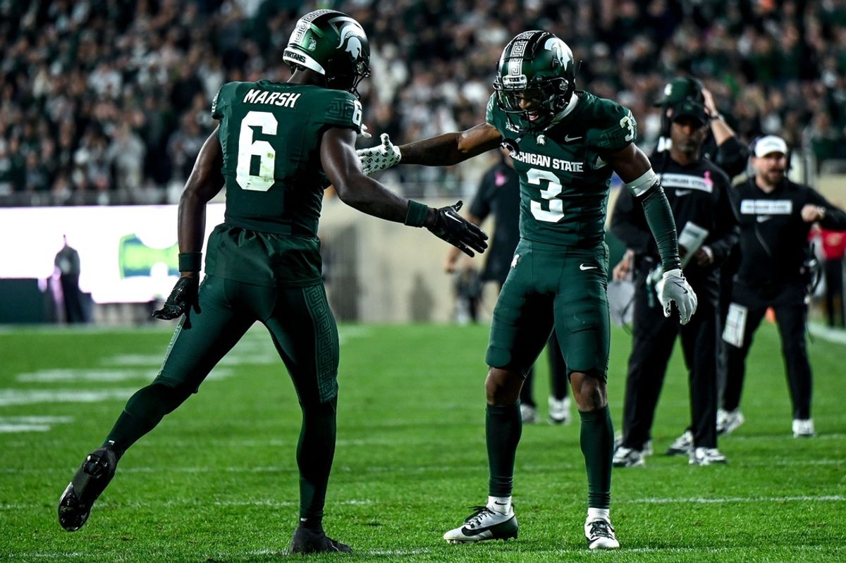 Michigan State's Montorie Foster Jr., right, celebrates his touchdown catch with Nick Marsh during the third quarter in the game against Iowa on Saturday, Oct. 19, 2024, at Spartan Stadium in East Lansing.