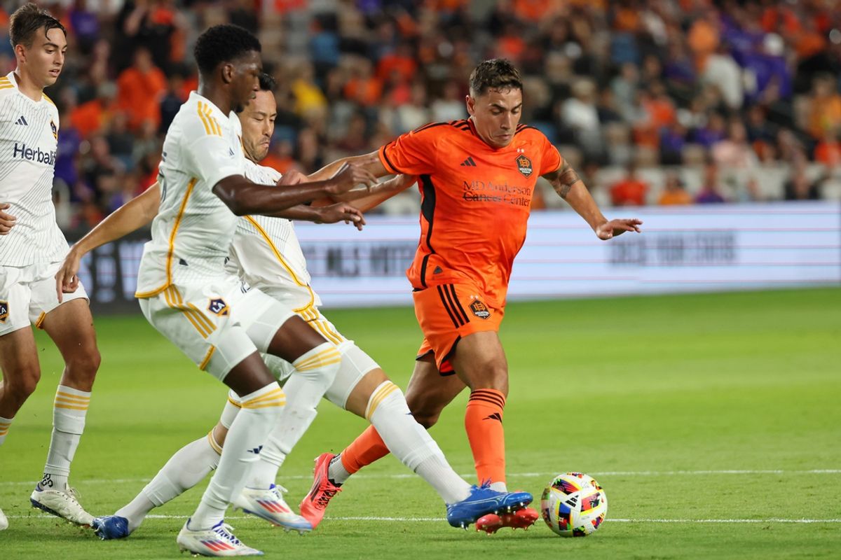 Oct 19, 2024; Houston, Texas, USA; Houston Dynamo FC forward Ezequiel Ponce (10) controls the ball against LA Galaxy defender Maya Yoshida (4) during the first half at Shell Energy Stadium. Mandatory Credit: Thomas Shea-Imagn Images