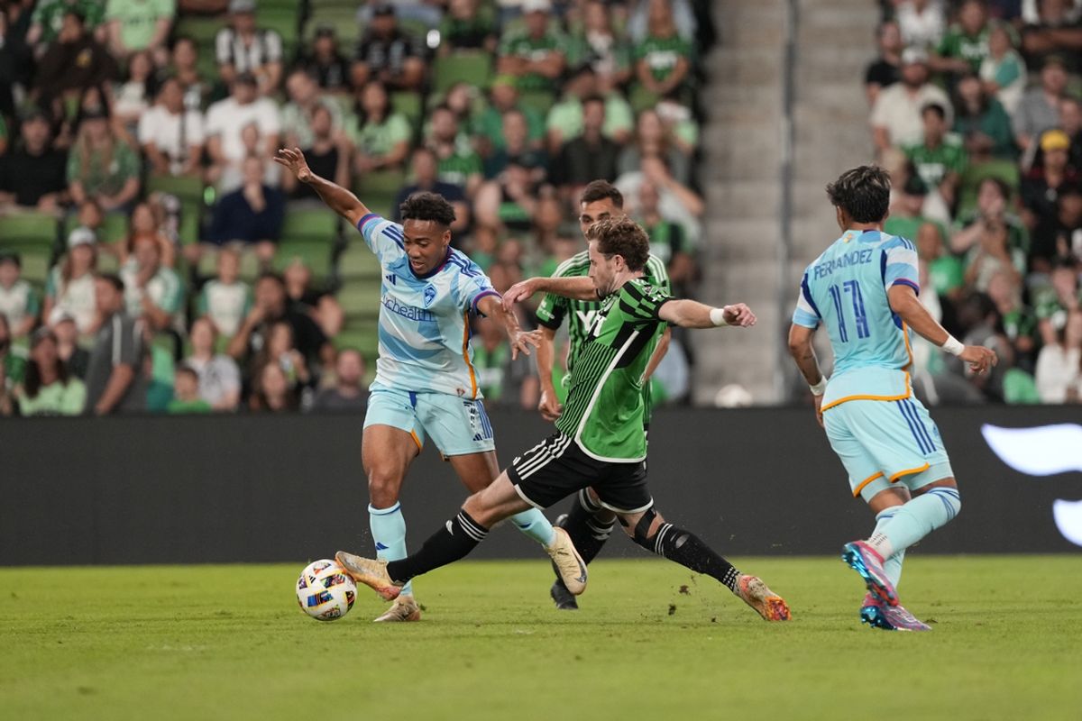 Oct 19, 2024; Austin, Texas, USA; Colorado Rapids forward Jonathan Lewis (7) battles Austin FC forward Jon Gallagher (17) for the ball in the first half at Q2 Stadium. Mandatory Credit: Scott Wachter-Imagn Images