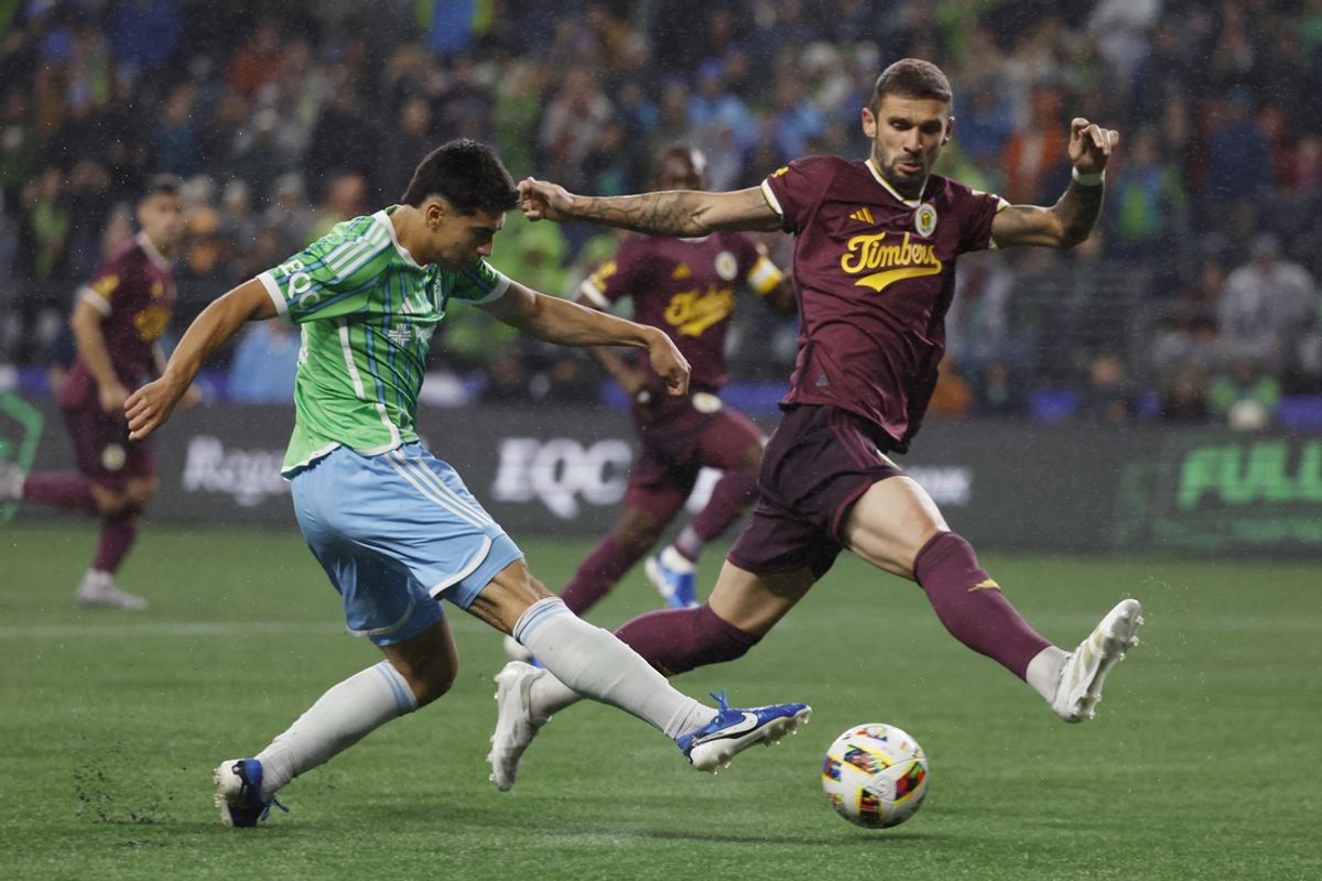Oct 19, 2024; Seattle, Washington, USA; Seattle Sounders FC midfielder Obed Vargas (18) controls the ball against Portland Timbers defender Finn Surman (20) in the second half at Lumen Field. Mandatory Credit: Joe Nicholson-Imagn Images