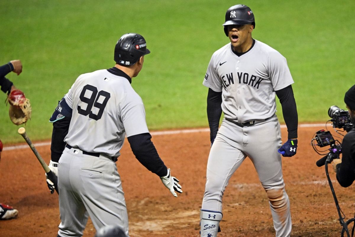 Oct 19, 2024; Cleveland, Ohio, USA; New York Yankees outfielder Juan Soto (22) celebrates with outfielder Aaron Judge (99) after hitting a three run home run during the tenth inning against the Cleveland Guardians during game five of the ALCS for the 2024 MLB playoffs at Progressive Field. Mandatory Credit: David Richard-Imagn Images