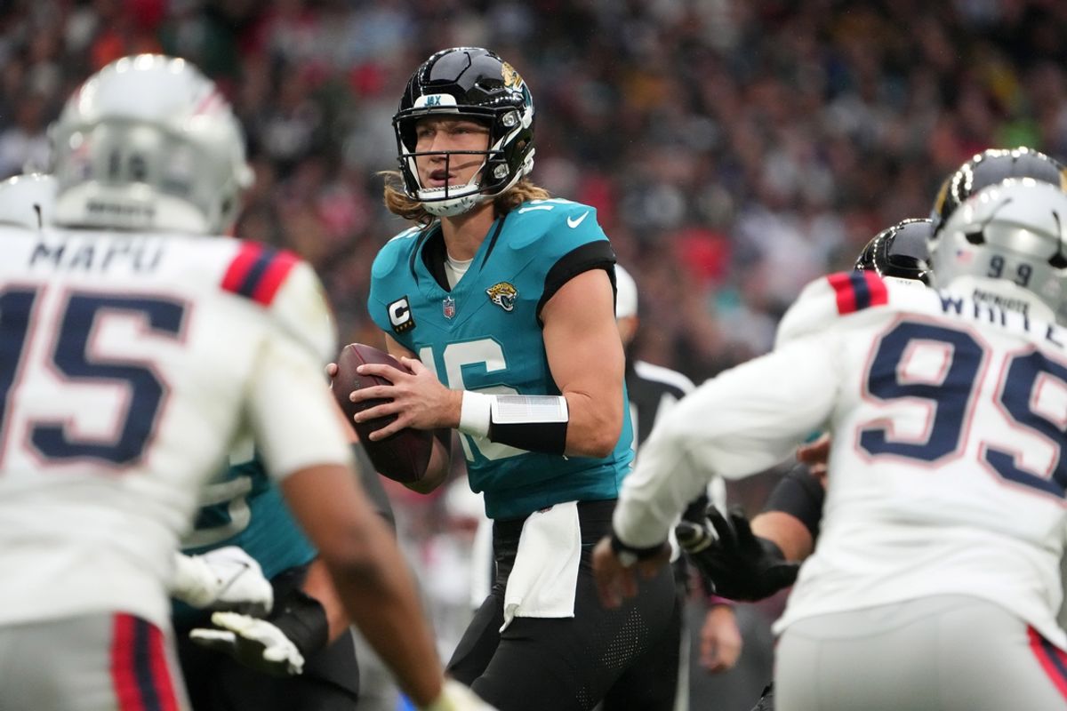 Oct 20, 2024; London, United Kingdom; Jacksonville Jaguars quarterback Trevor Lawrence (16) throws the ball against the New England Patriots in the first half of an NFL International Series game at Wembley Stadium. Mandatory Credit: Kirby Lee-Imagn Images
