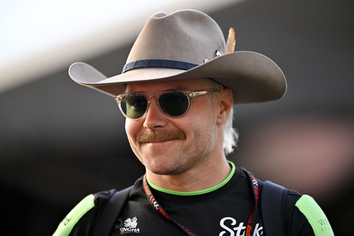 Oct 20, 2024; Austin, Texas, USA; Stake F1 Team Kick Sauber driver Valtteri Bottas (77) of Team Finland walks through the track entrance before the 2024 Formula One US Grand Prix at Circuit of the Americas. Mandatory Credit: Jerome Miron-Imagn Images