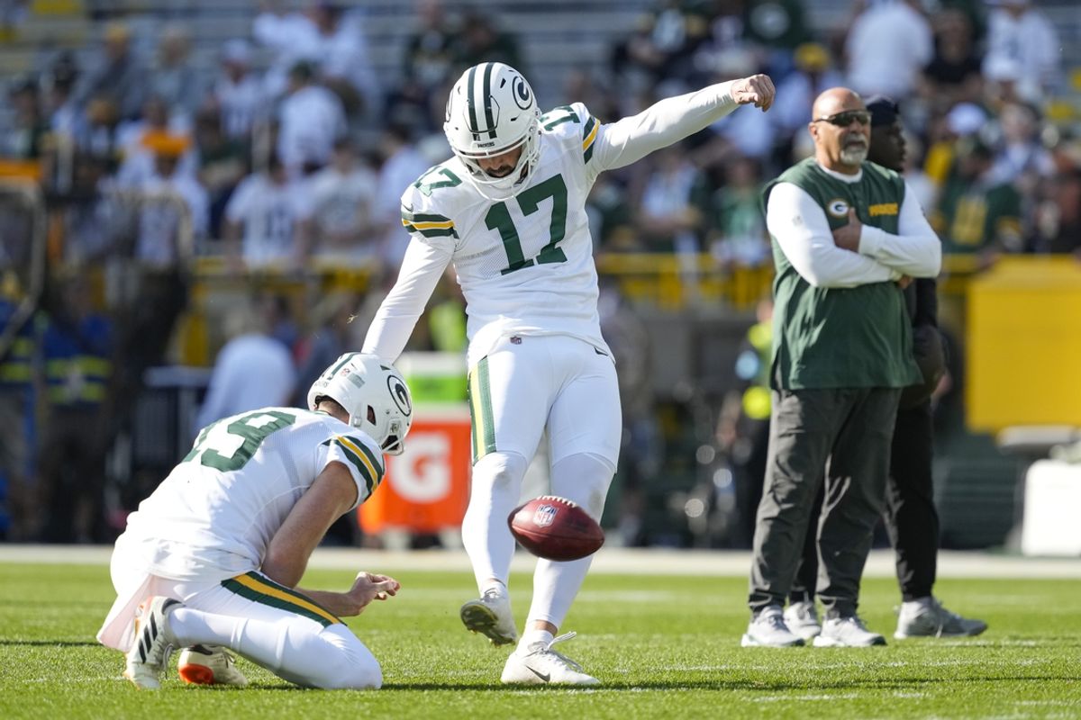 Oct 20, 2024; Green Bay, Wisconsin, USA;  Green Bay Packers kicker Brandon McManus (17) kicks a football during warmups prior to the game against the Houston Texans at Lambeau Field. Mandatory Credit: Jeff Hanisch-Imagn Images