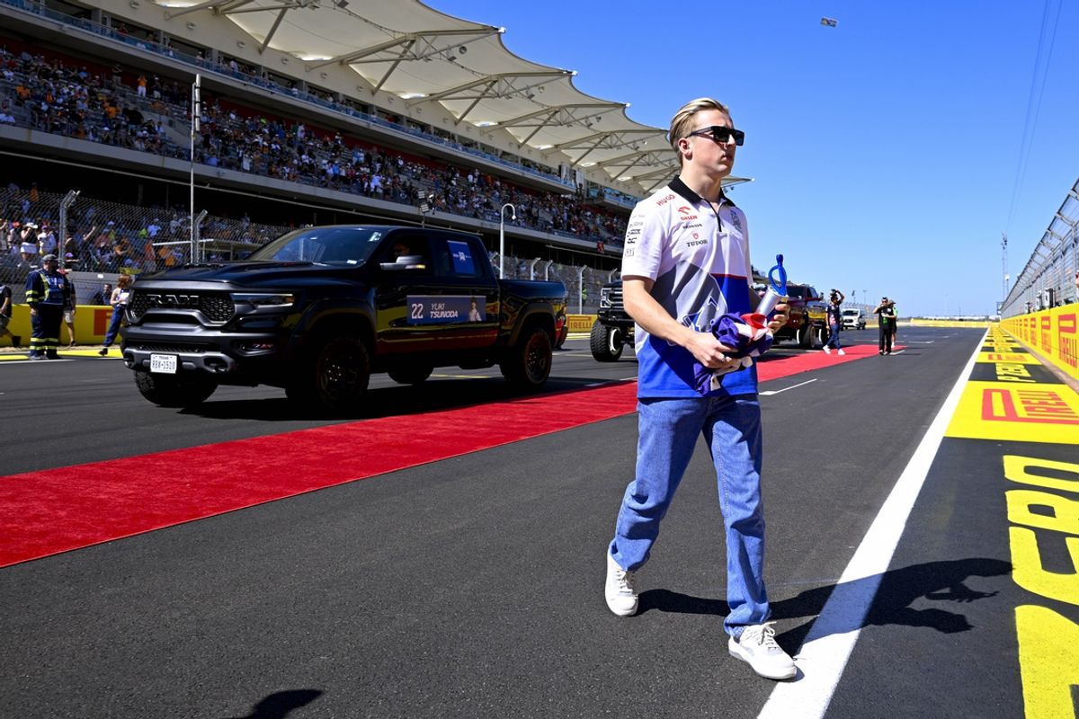 Oct 20, 2024; Austin, Texas, USA; Visa Cash App RB Formula One Team driver Liam Lawson (30) of Team New Zealand walks back to the paddock after the driver’s parade before the 2024 Formula One US Grand Prix at Circuit of the Americas. Mandatory Credit: Jerome Miron-Imagn Images