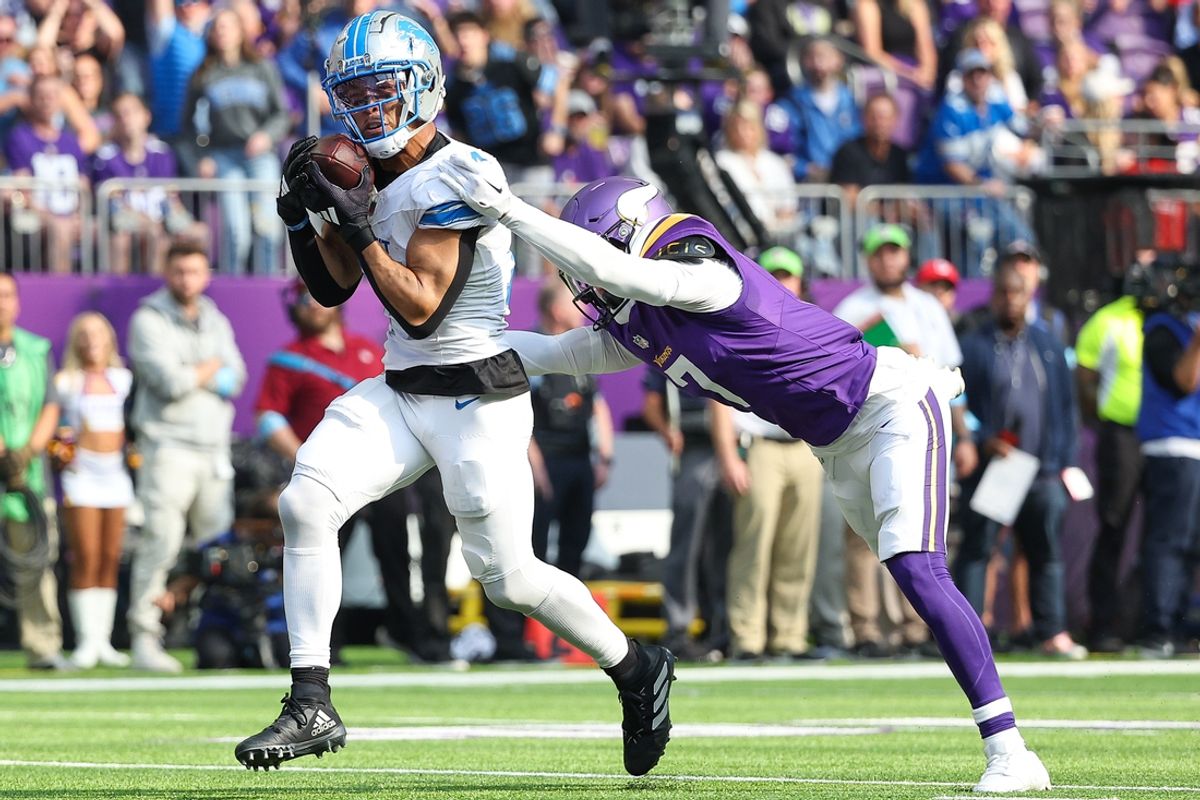 Oct 20, 2024; Minneapolis, Minnesota, USA; Detroit Lions wide receiver Amon-Ra St. Brown (14) catches a pass for a touchdown against the Minnesota Vikings during the second quarter at U.S. Bank Stadium. Mandatory Credit: Matt Krohn-Imagn Images