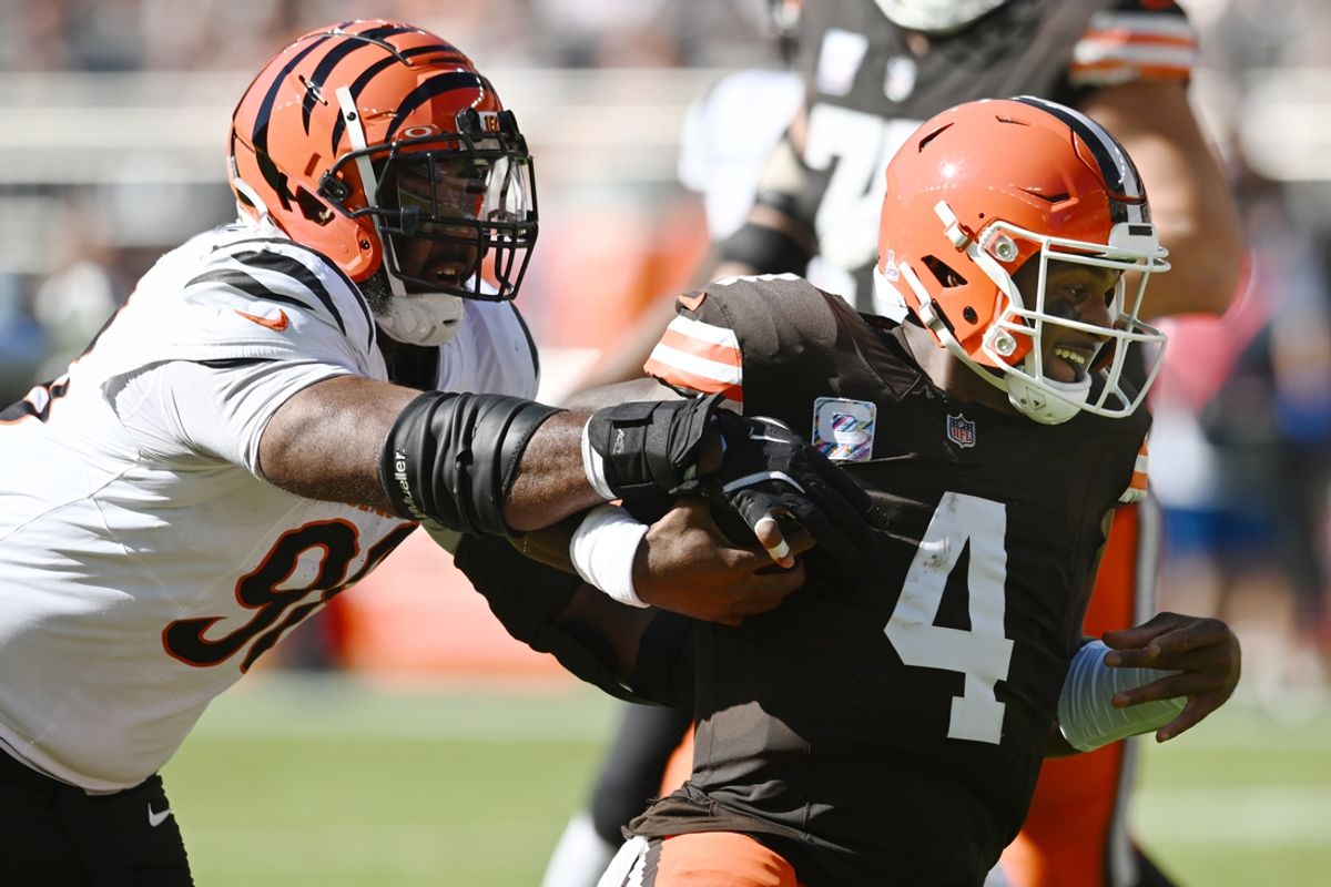 Oct 20, 2024; Cleveland, Ohio, USA; Cincinnati Bengals defensive tackle Sheldon Rankins (98) tackles Cleveland Browns quarterback Deshaun Watson (4) during the first half at Huntington Bank Field. Mandatory Credit: Ken Blaze-Imagn Images