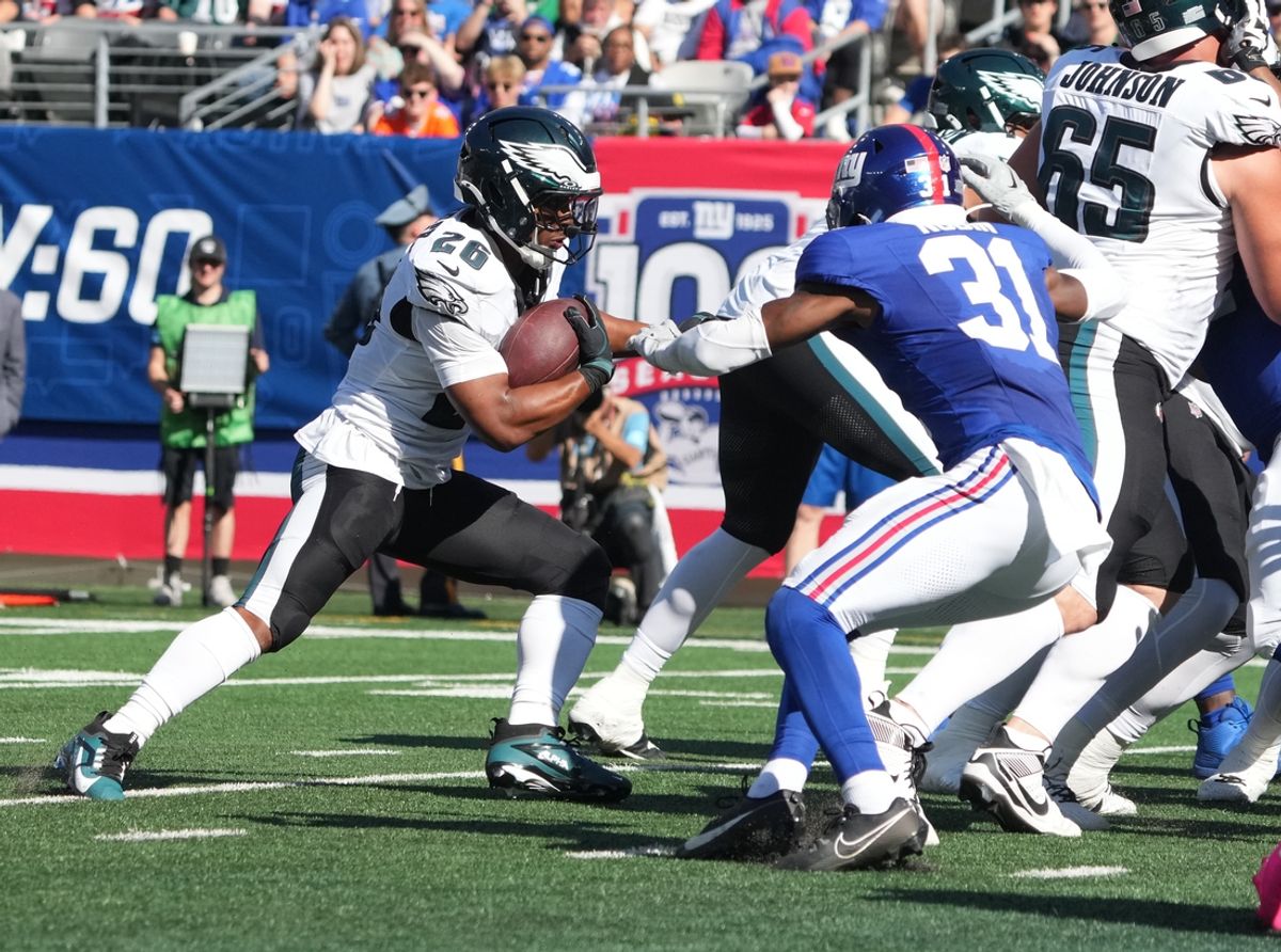 Oct 20, 2024; East Rutherford, New Jersey, USA;  Philadelphia Eagles running back Saquon Barkley (26) scores a first half touchdown against the New York Giants at MetLife Stadium. Mandatory Credit: Robert Deutsch-Imagn Images