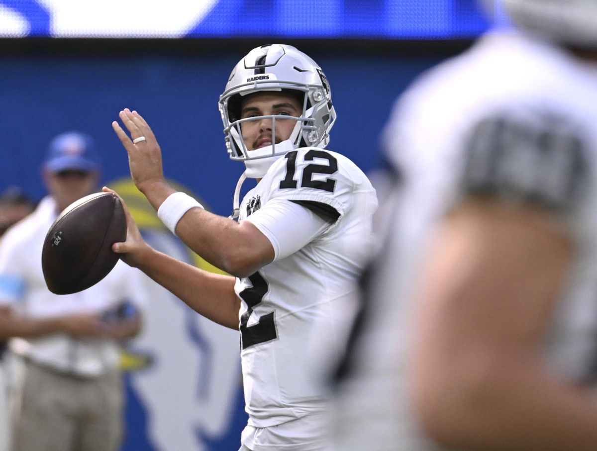 Oct 20, 2024; Inglewood, California, USA; Las Vegas Raiders quarterback Aidan O'Connell (12) throws a pass during warmups before the game against the Los Angeles Rams at SoFi Stadium. Mandatory Credit: Alex Gallardo-Imagn Images