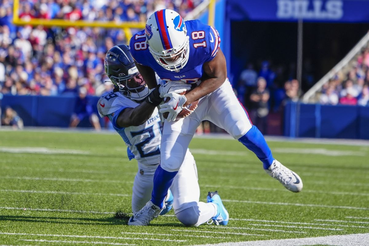 Oct 20, 2024; Orchard Park, New York, USA; Tennessee Titans cornerback Jarvis Brownlee Jr. (29) tackles Buffalo Bills wide receiver Amari Cooper (18) after he made a catch during the second half at Highmark Stadium. Mandatory Credit: Gregory Fisher-Imagn Images
