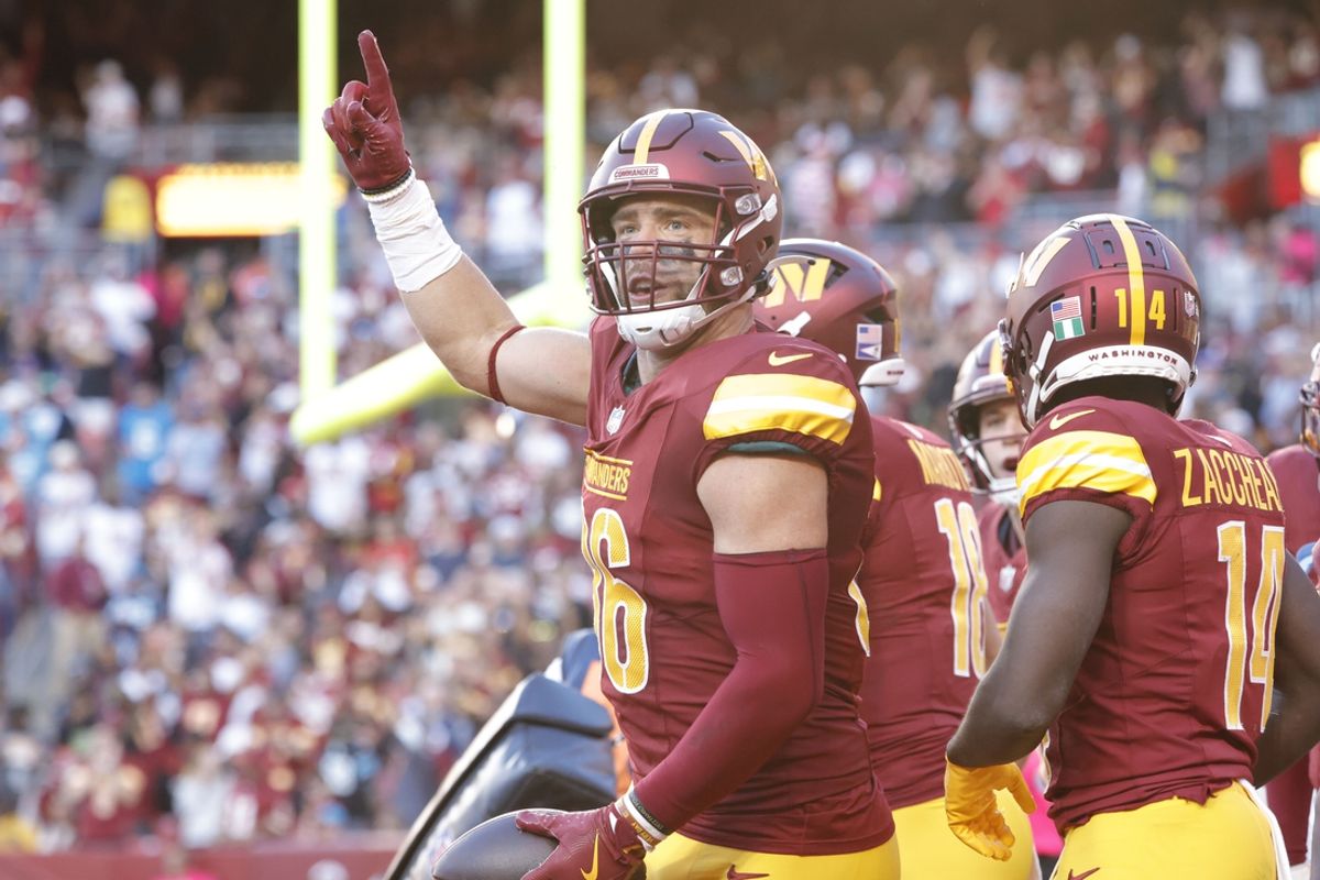 Oct 20, 2024; Landover, Maryland, USA; Washington Commanders tight end Zach Ertz (86) celebrates with fans in the stands after scoring a touchdown during the second quarter against the Carolina Panthers at Northwest Stadium. Mandatory Credit: Amber Searls-Imagn Images