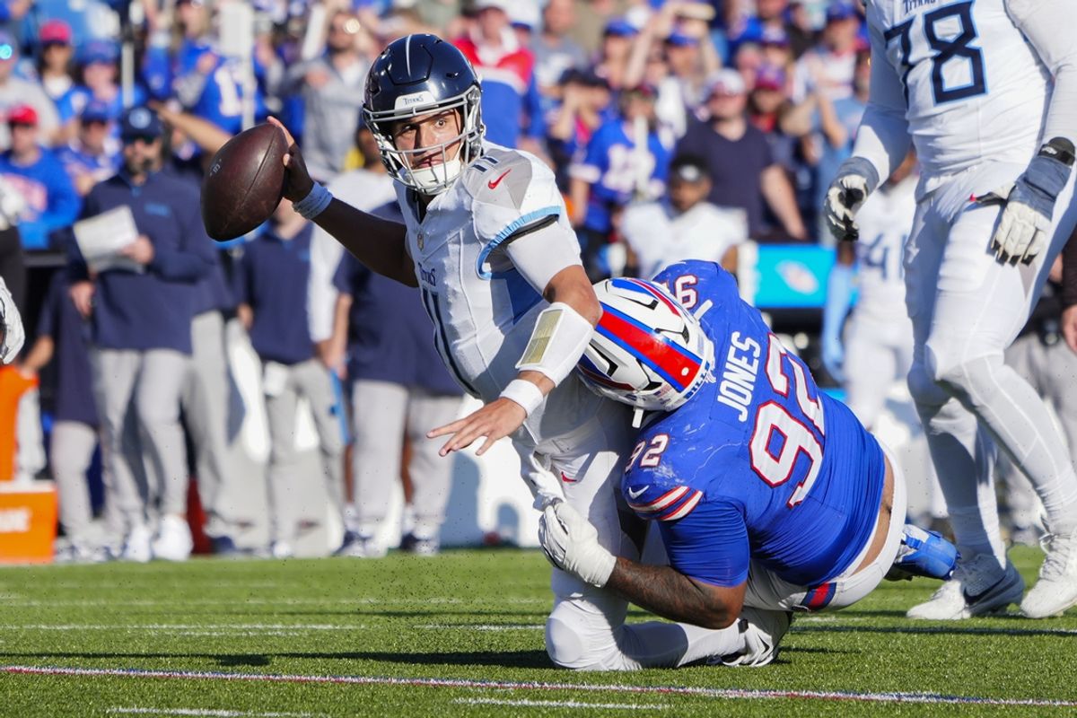 Oct 20, 2024; Orchard Park, New York, USA; Buffalo Bills defensive tackle DaQuan Jones (92) sacks Tennessee Titans quarterback Mason Rudolph (11) during the second half at Highmark Stadium. Mandatory Credit: Gregory Fisher-Imagn Images
