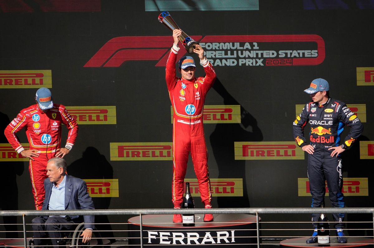 Scuderia Ferrari driver Charles Leclerc of Team Monaco celebrates his win at the Formula 1 Pirelli United States Grand Prix at Circuit of the Americas Sunday October 20, 2024. Scuderia Ferrari driver Carlos Sainz of Team Spain, left, placed second. Oracle Red Bull Racing driver Max Verstappen of Team Netherlands, right, finished third.