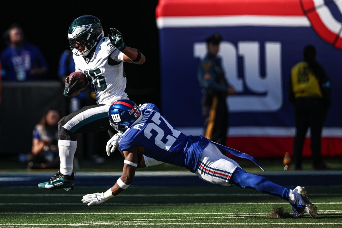 Oct 20, 2024; East Rutherford, New Jersey, USA; Philadelphia Eagles running back Saquon Barkley (26) carries the ball as New York Giants safety Jason Pinnock (27) pursues during the second half at MetLife Stadium. Mandatory Credit: Vincent Carchietta-Imagn Images