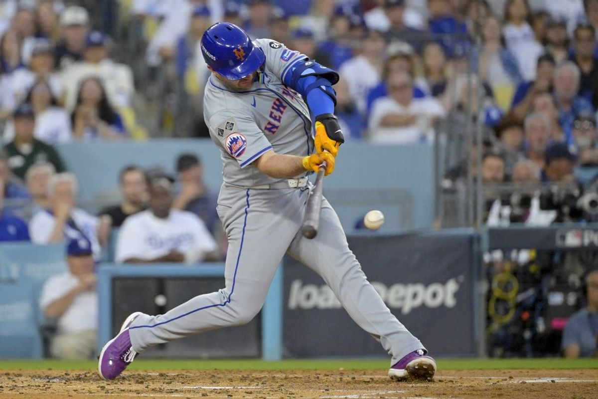 Oct 20, 2024; Los Angeles, California, USA; New York Mets first baseman Pete Alonso (20) hits a single in the third inning against the Los Angeles Dodgers during game six of the NLCS for the 2024 MLB playoffs at Dodger Stadium. Mandatory Credit: Jayne Kamin-Oncea-Imagn Images