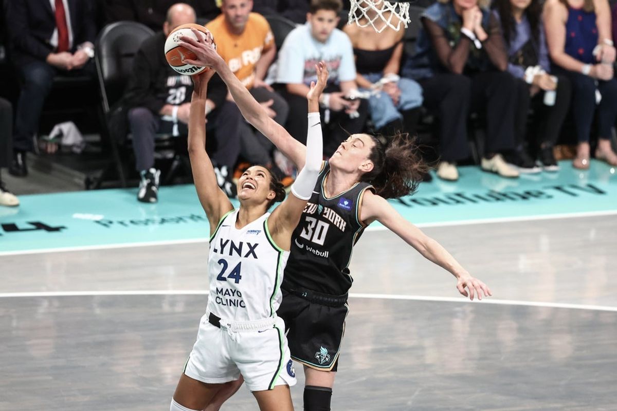 Oct 20, 2024; Brooklyn, New York, USA; Minnesota Lynx forward Napheesa Collier (24) is blocked from behind by New York Liberty forward Breanna Stewart (30) in the third quarter during game five of the 2024 WNBA Finals at Barclays Center. Mandatory Credit: Wendell Cruz-Imagn Images