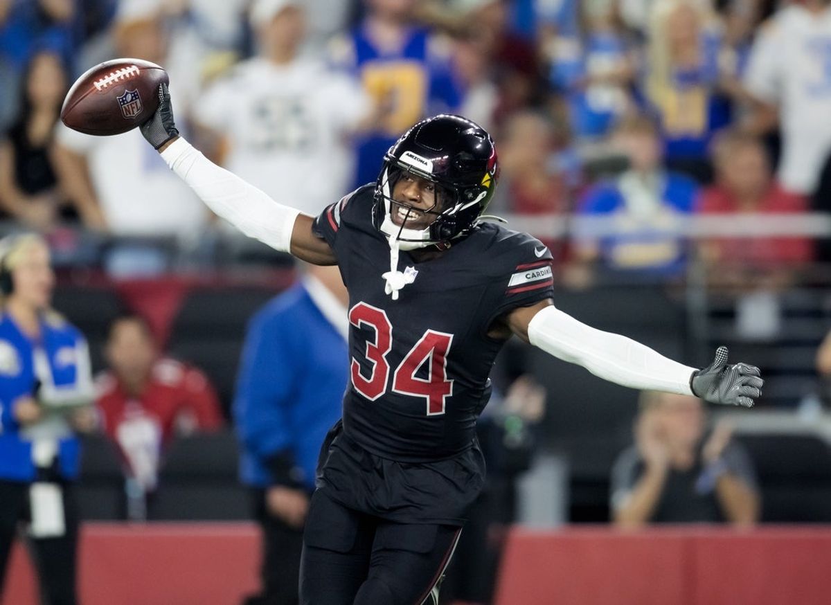 Oct 21, 2024; Glendale, Arizona, USA; Arizona Cardinals safety Jalen Thompson (34) celebrates after recovering a fumble from the Los Angeles Chargers in the first half at State Farm Stadium. Mandatory Credit: Mark J. Rebilas-Imagn Images