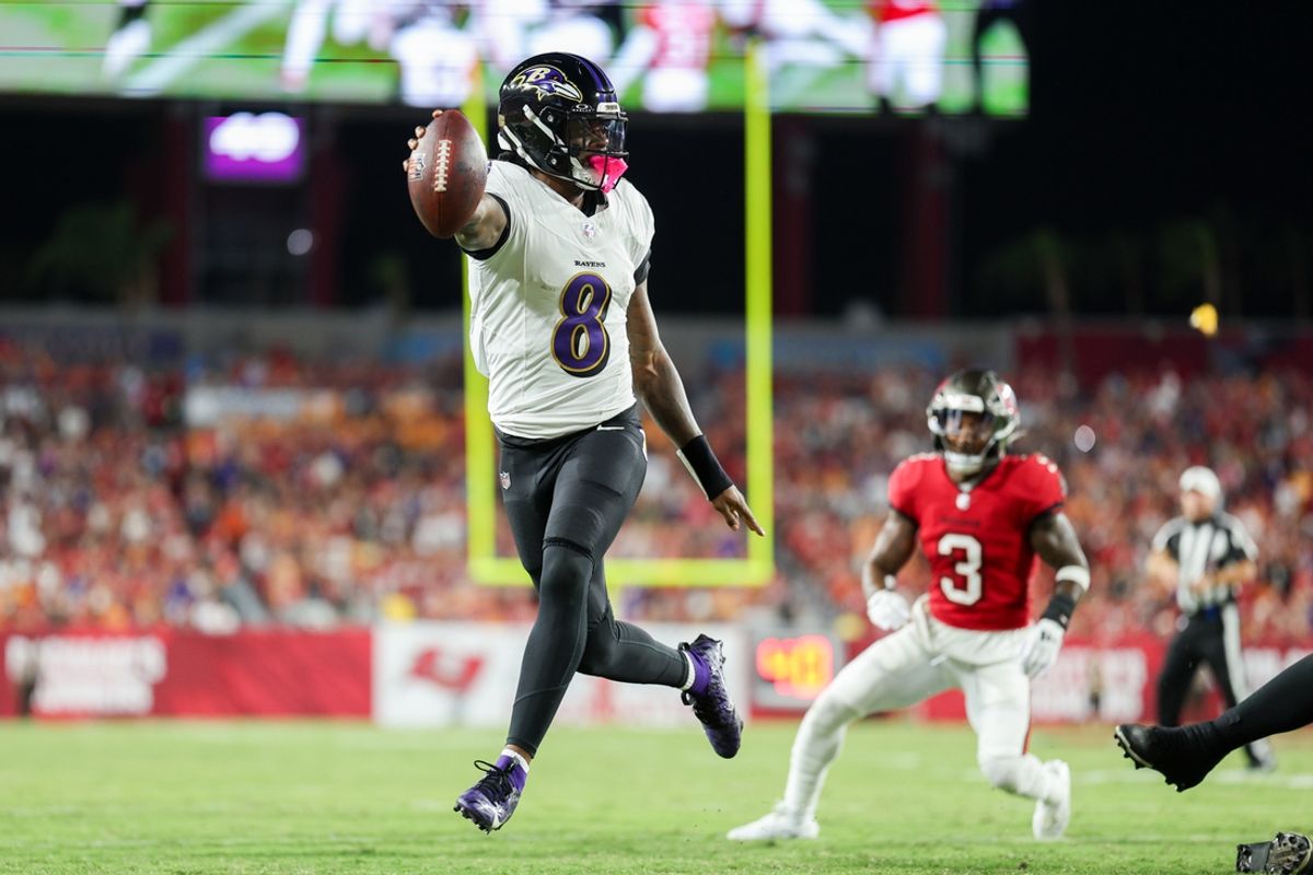 Oct 21, 2024; Tampa, Florida, USA; Baltimore Ravens quarterback Lamar Jackson (8) runs with the ball against the Tampa Bay Buccaneers in the second quarter at Raymond James Stadium. Mandatory Credit: Nathan Ray Seebeck-Imagn Images