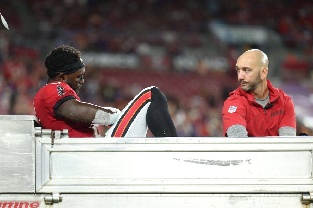 Oct 21, 2024; Tampa, Florida, USA; Tampa Bay Buccaneers wide receiver Chris Godwin (14) is carted off the field against the Baltimore Ravens in the fourth quarter at Raymond James Stadium. Mandatory Credit: Nathan Ray Seebeck-Imagn Images
