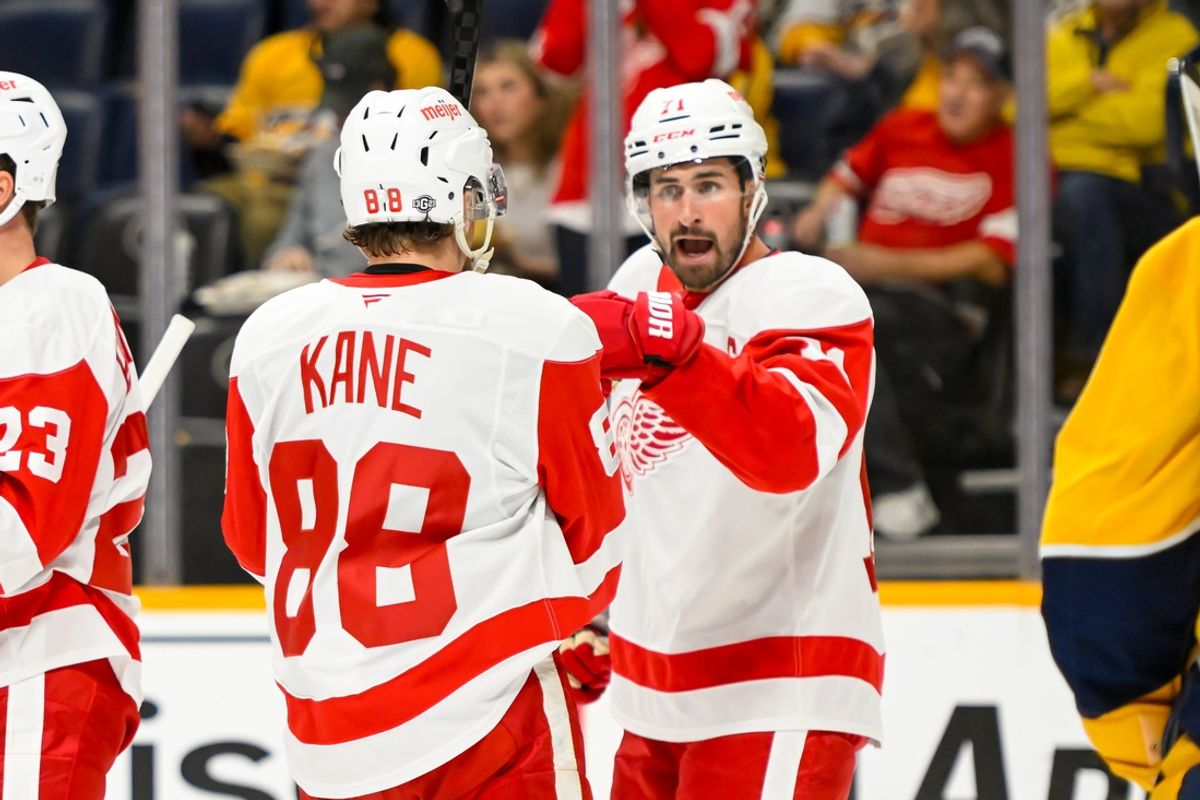 Oct 19, 2024; Nashville, Tennessee, USA; Detroit Red Wings right wing Patrick Kane (88) celebrates the goal of center Dylan Larkin (71) against the Nashville Predators  during the second period at Bridgestone Arena. Mandatory Credit: Steve Roberts-Imagn Images