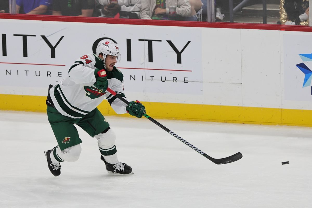 Oct 22, 2024; Sunrise, Florida, USA; Minnesota Wild center Jakub Lauko (94) moves the puck against the Florida Panthers during the third period at Amerant Bank Arena. Mandatory Credit: Sam Navarro-Imagn Images