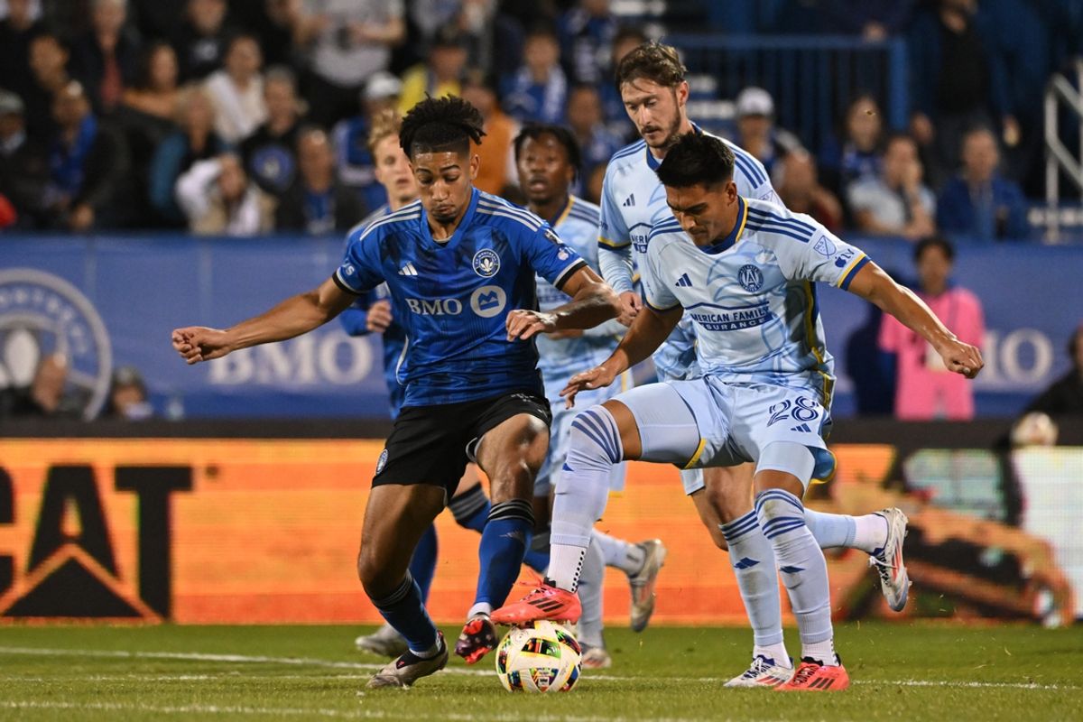 Oct 22, 2024; Montreal, Quebec, CAN; CF Montreal midfielder Nathan-Dylan Saliba (19) battles Atlanta United forward Tyler Wolff (28) for the ball in the second half at Stade Saputo. Mandatory Credit: David Kirouac-Imagn Images