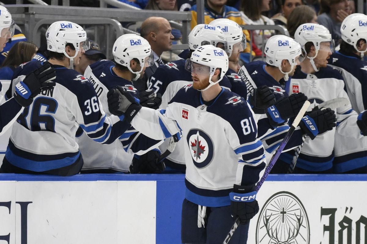 Oct 22, 2024; St. Louis, Missouri, USA; Winnipeg Jets left wing Kyle Connor (81) is congratulated by teammates after scoring a goal against the St. Louis Blues during the second period at Enterprise Center. Mandatory Credit: Jeff Le-Imagn Images