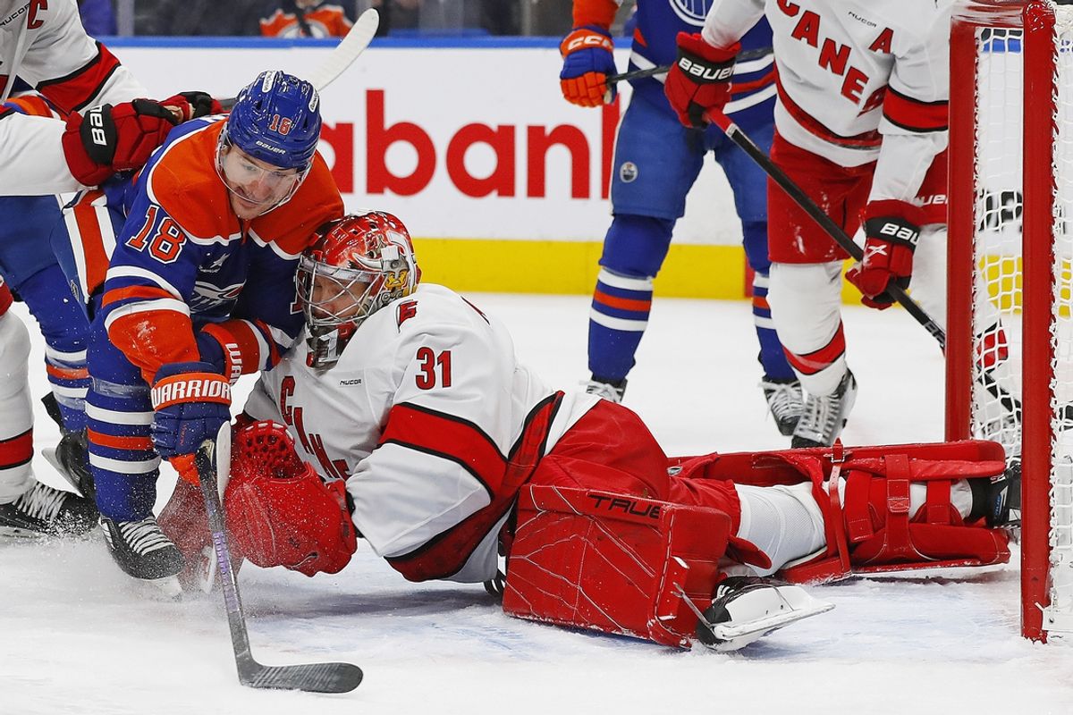 Oct 22, 2024; Edmonton, Alberta, CAN; Carolina Hurricanes goaltender Frederik Andersen (31) makes a save on Edmonton Oilers forward Zach Hyman (18) during the first period at Rogers Place. Mandatory Credit: Perry Nelson-Imagn Images