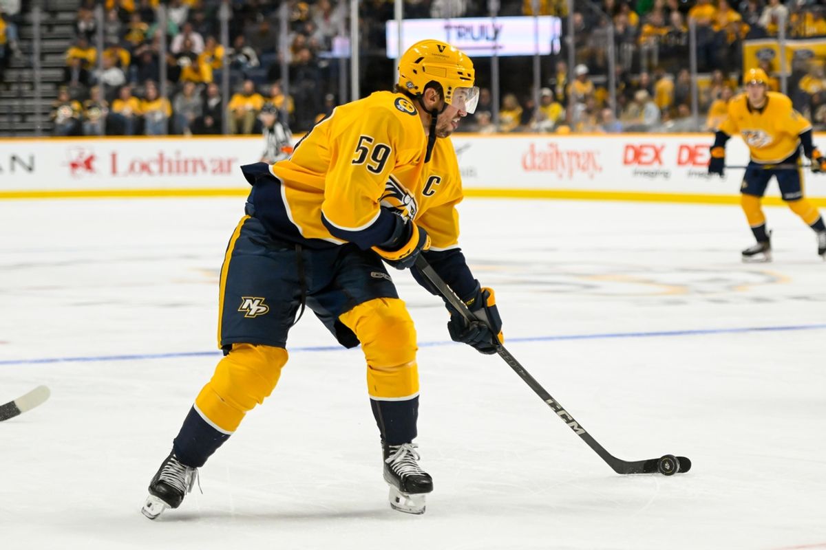 Oct 22, 2024; Nashville, Tennessee, USA;  Nashville Predators defenseman Roman Josi (59) skates with the puck against against the Boston Bruins during the third period at Bridgestone Arena. Mandatory Credit: Steve Roberts-Imagn Images