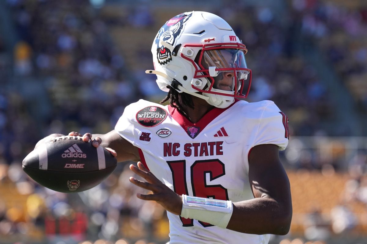Oct 19, 2024; Berkeley, California, USA; North Carolina State Wolfpack quarterback CJ Bailey (16) warms up during the first quarter against the California Golden Bears at California Memorial Stadium. Mandatory Credit: Darren Yamashita-Imagn Images