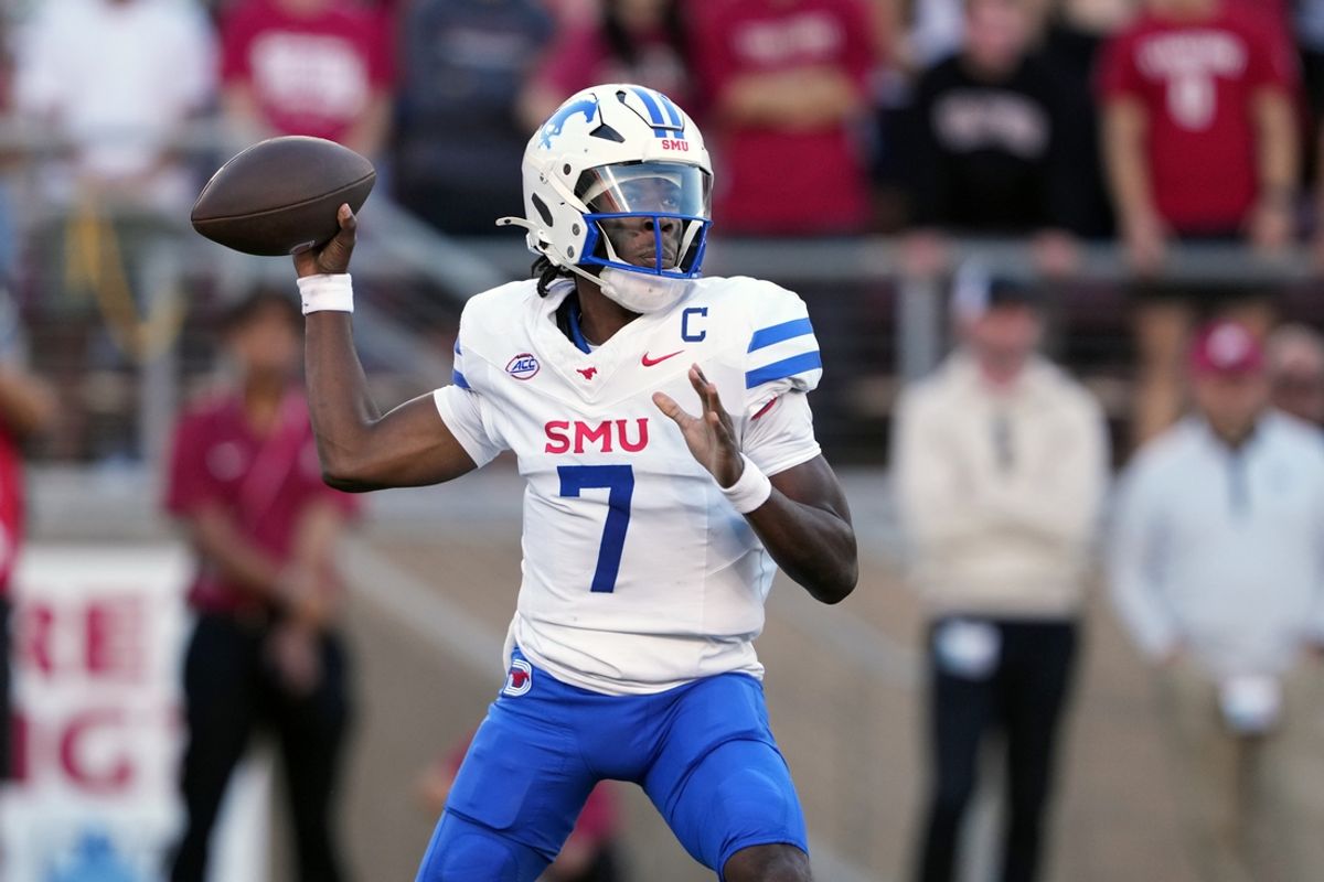Oct 19, 2024; Stanford, California, USA; Southern Methodist Mustangs quarterback Kevin Jennings (7) throws a pass against the Stanford Cardinal during the first quarter at Stanford Stadium. Mandatory Credit: Darren Yamashita-Imagn Images