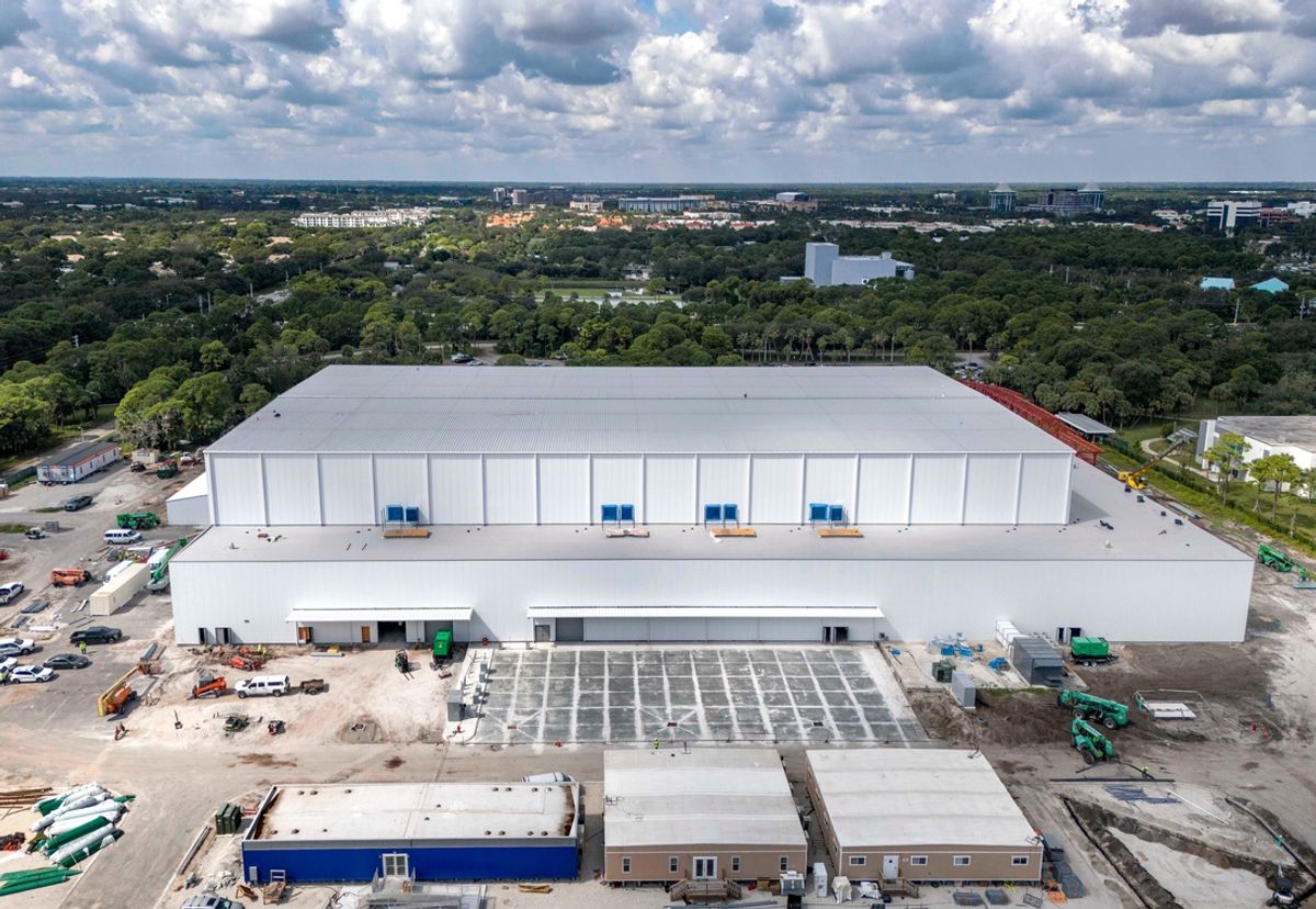Construction crews work on the SoFi Center for the TGL indoor golf league that was founded by Tiger Woods and Rory McIlroy on Palm Beach State College land on October 21, 2024, in Palm Beach Gardens, Florida.