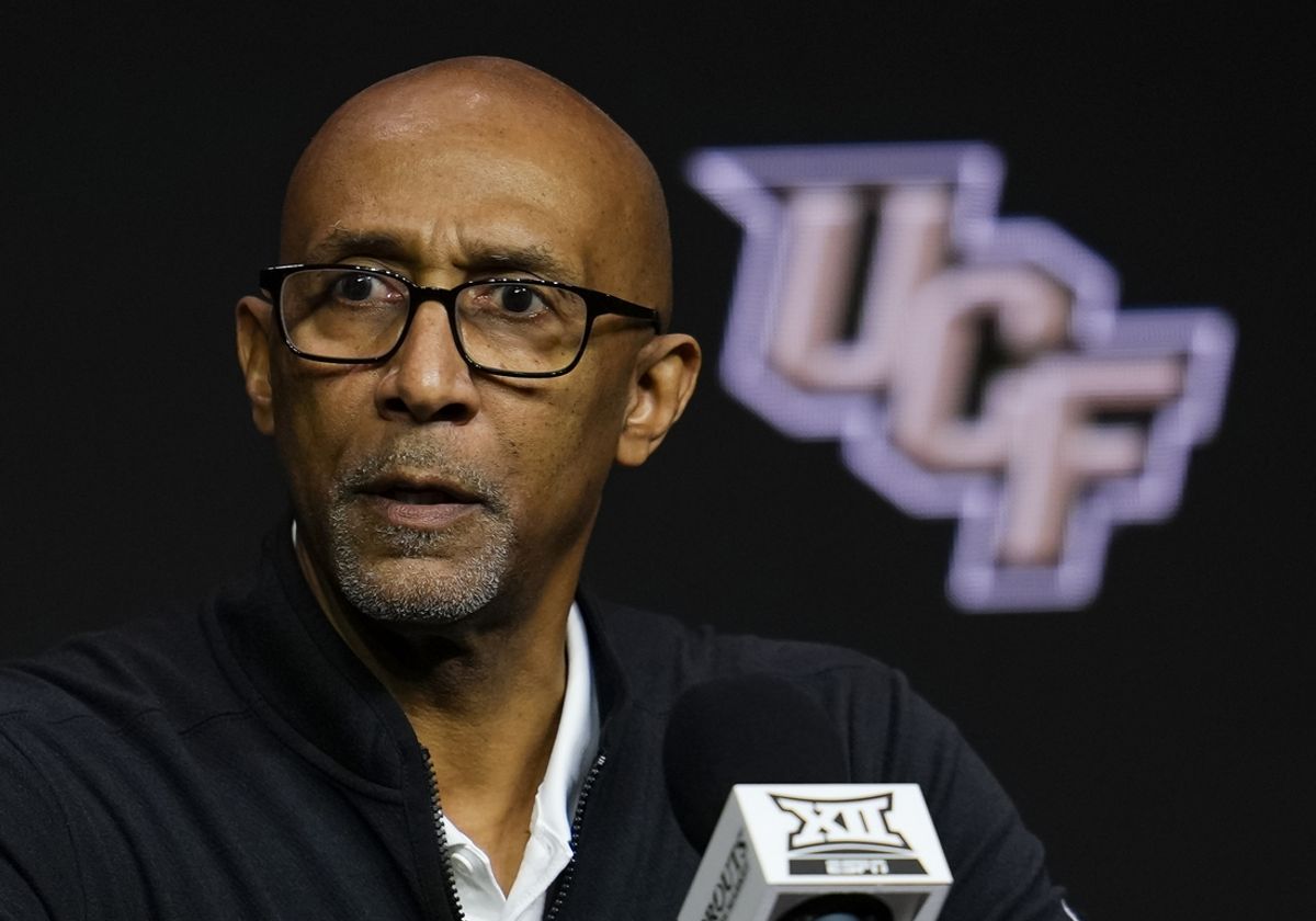 Oct 23, 2024; Kansas City, MO, USA; UCF Knights head coach Johnny Dawkins talks to media during the Big 12 Men’s Basketball Media Day at T-Mobile Center. Mandatory Credit: Jay Biggerstaff-Imagn Images