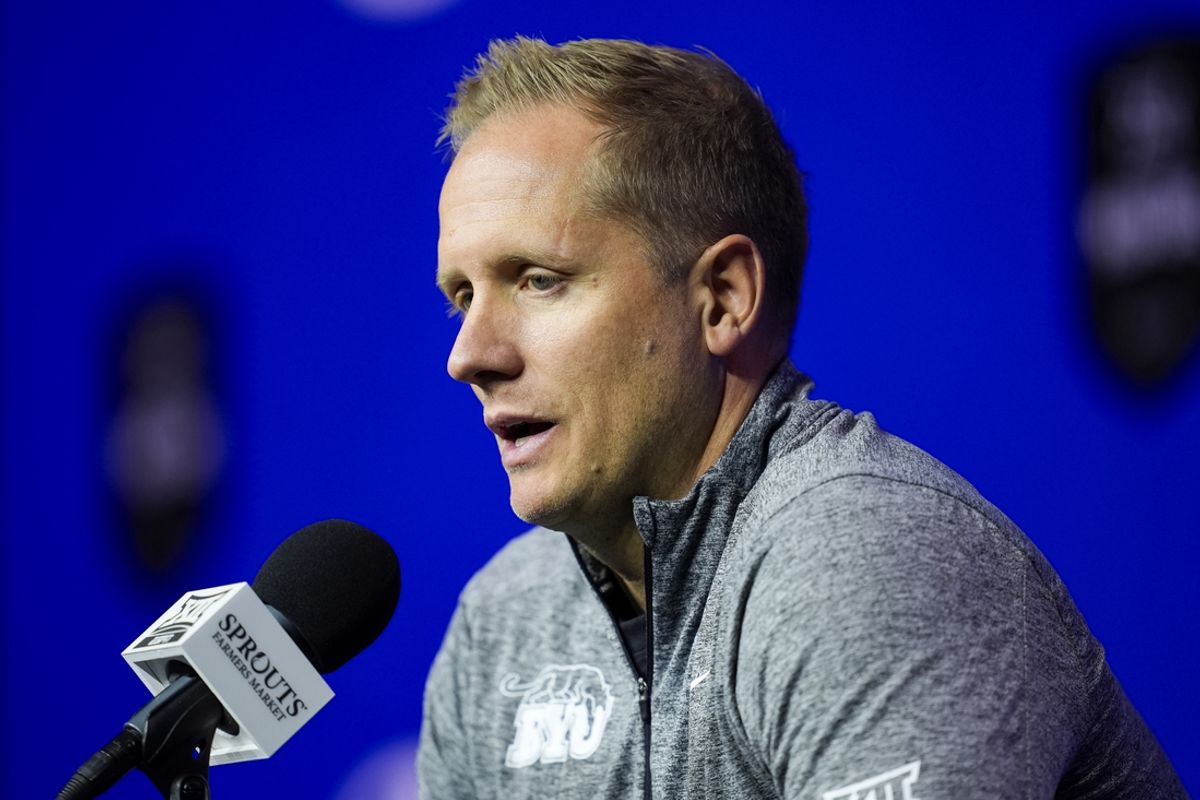 Oct 23, 2024; Kansas City, MO, USA; Brigham Young Cougars head coach Kevin Young talks to media during the Big 12 Men’s Basketball Media Day at T-Mobile Center. Mandatory Credit: Jay Biggerstaff-Imagn Images