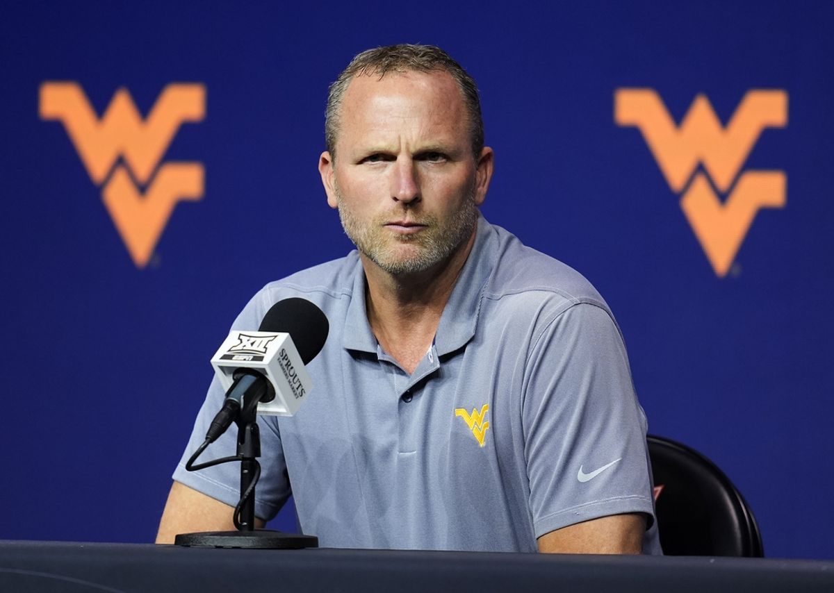 Oct 23, 2024; Kansas City, MO, USA; West Virginia Mountaineers head coach Darian DeVries talks to media during the Big 12 Men’s Basketball Media Day at T-Mobile Center. Mandatory Credit: Jay Biggerstaff-Imagn Images
