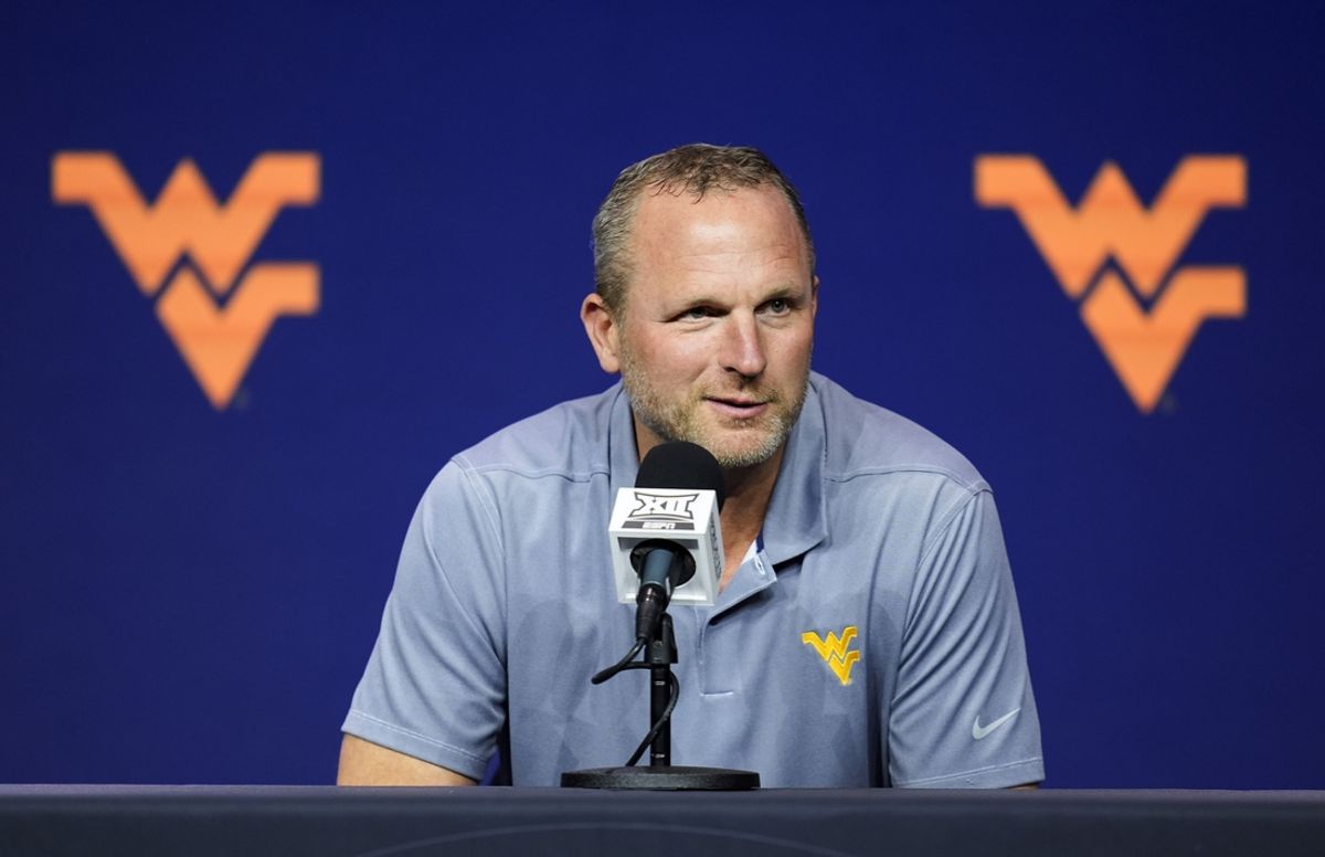 Oct 23, 2024; Kansas City, MO, USA; West Virginia Mountaineers head coach Darian DeVries talks to media during the Big 12 Men’s Basketball Media Day at T-Mobile Center. Mandatory Credit: Jay Biggerstaff-Imagn Images