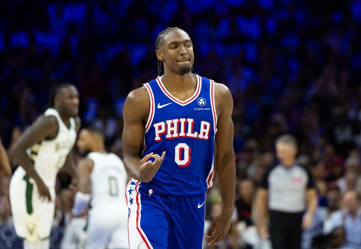 Oct 23, 2024; Philadelphia, Pennsylvania, USA; Philadelphia 76ers guard Tyrese Maxey (0) reacts to his three pointer against the Milwaukee Bucks during the first quarter at Wells Fargo Center. Mandatory Credit: Bill Streicher-Imagn Images