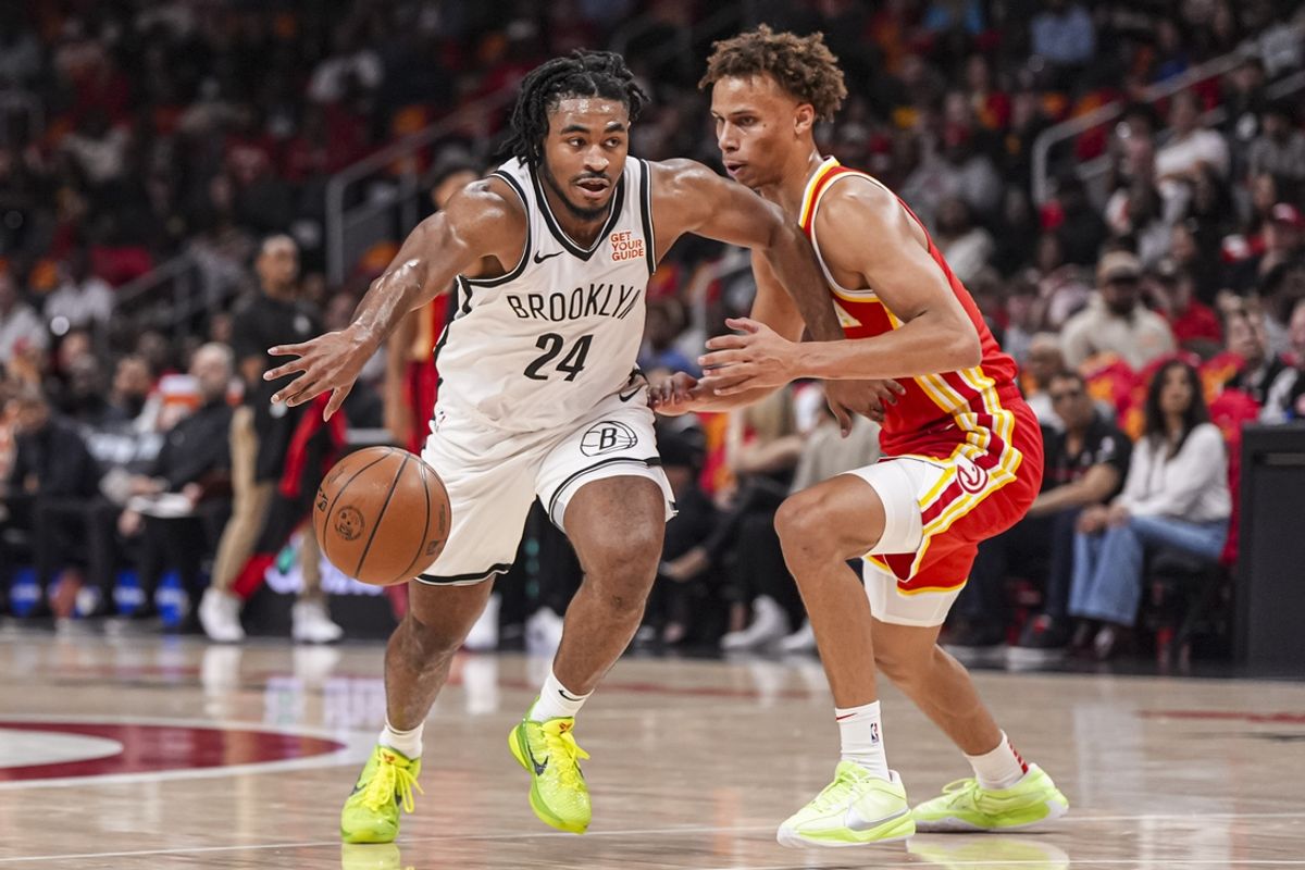 Oct 23, 2024; Atlanta, Georgia, USA; Brooklyn Nets guard Cam Thomas (24) tries to dribble against Atlanta Hawks guard Dyson Daniels (5) during the first half at State Farm Arena. Mandatory Credit: Dale Zanine-Imagn Images