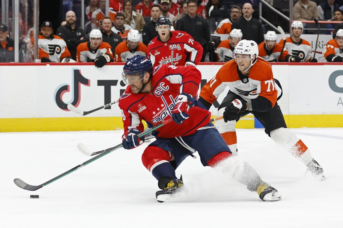 Oct 23, 2024; Washington, District of Columbia, USA; Washington Capitals left wing Alex Ovechkin (8) skates with the puck as Philadelphia Flyers right wing Tyson Foerster (71) chase in the first period at Capital One Arena. Mandatory Credit: Geoff Burke-Imagn Images