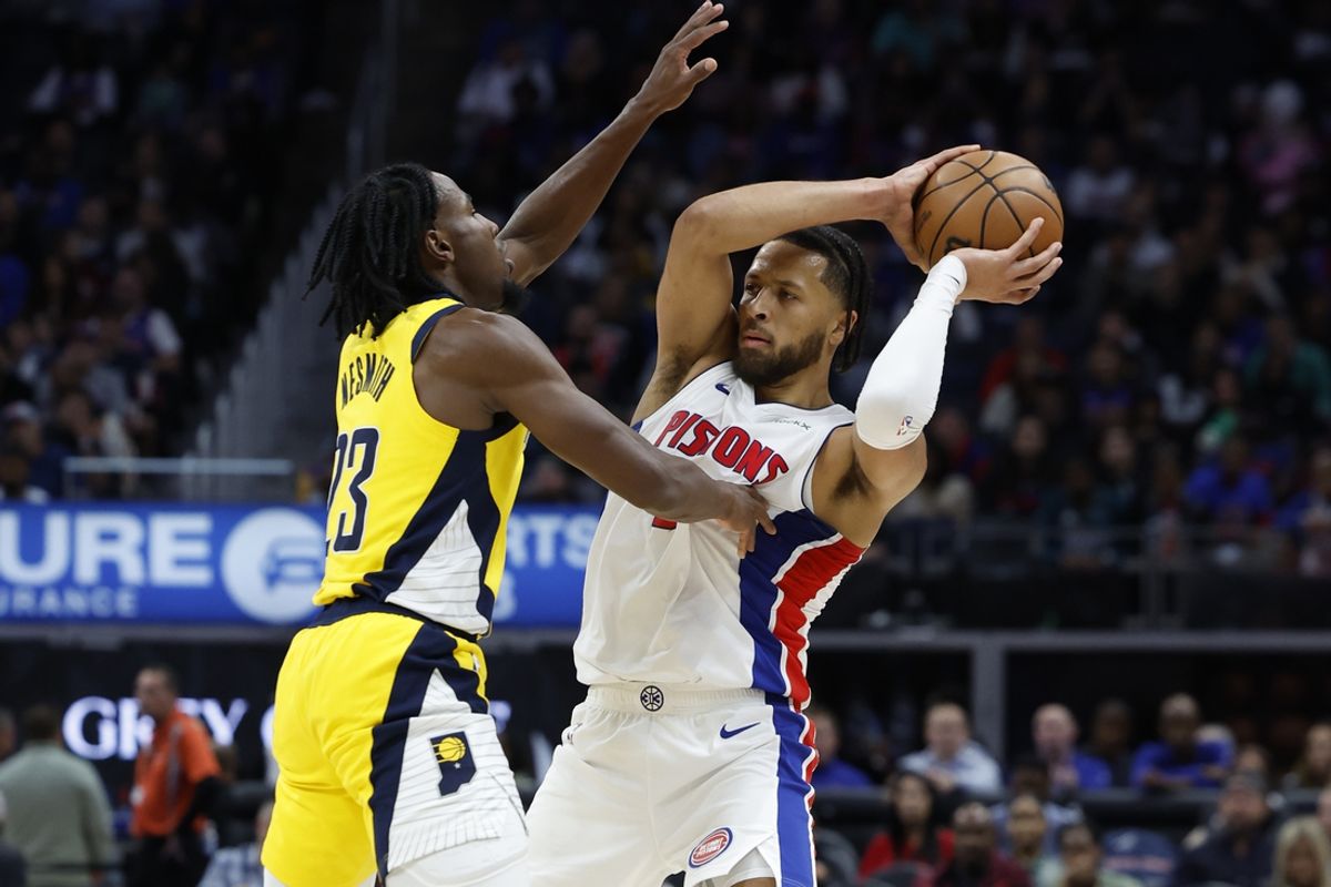 Oct 23, 2024; Detroit, Michigan, USA;  Detroit Pistons guard Cade Cunningham (2) is defended by Indiana Pacers forward Aaron Nesmith (23) in the first half at Little Caesars Arena. Mandatory Credit: Rick Osentoski-Imagn Images