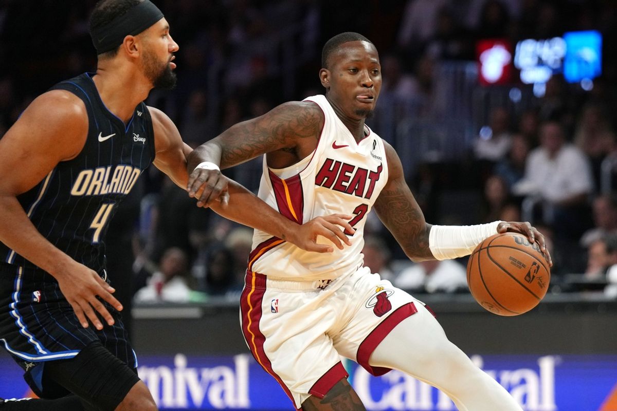 Oct 23, 2024; Miami, Florida, USA;  Miami Heat guard Terry Rozier (2) drives past Orlando Magic guard Jalen Suggs (4) during the first half at Kaseya Center. Mandatory Credit: Jim Rassol-Imagn Images