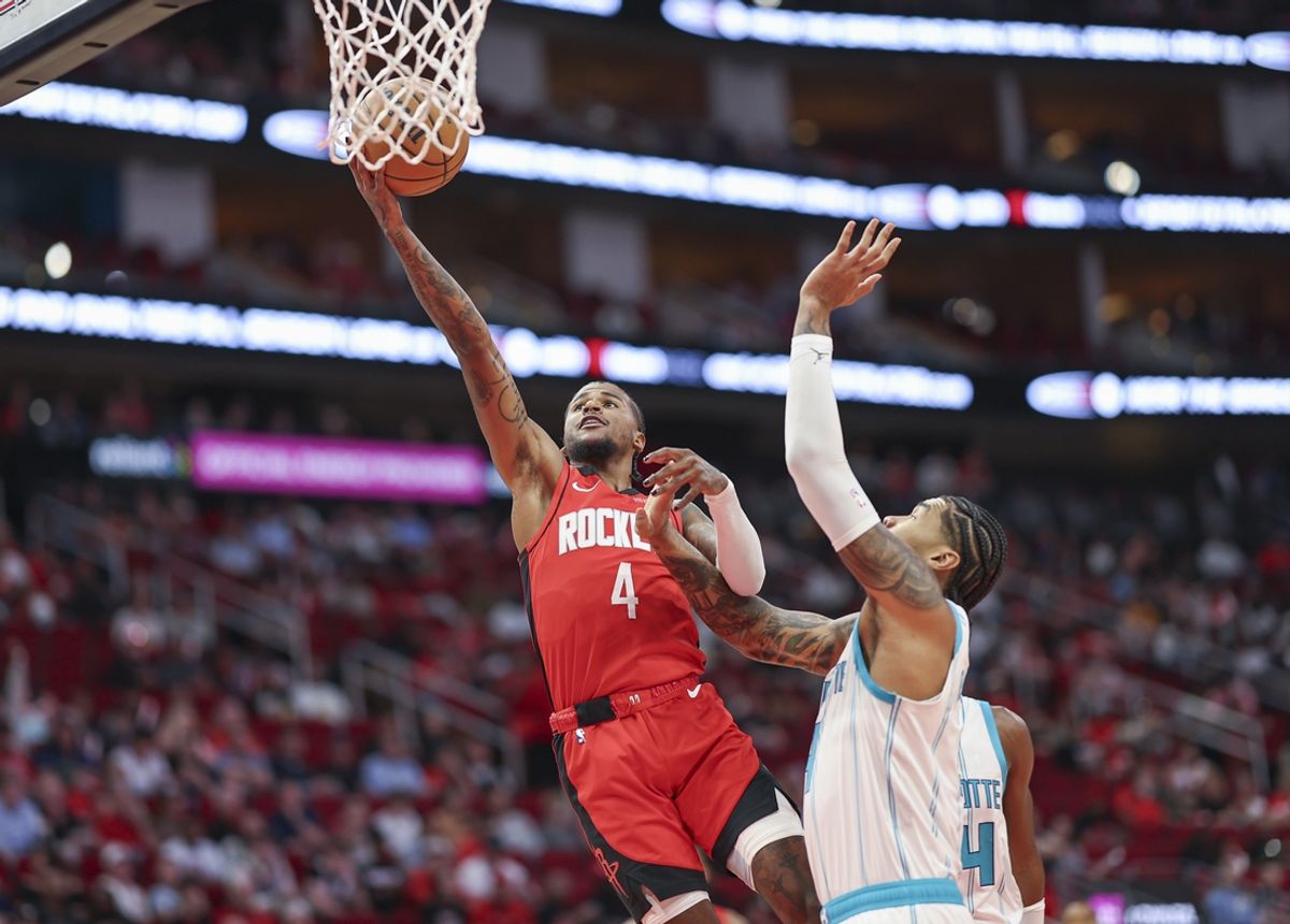 Oct 23, 2024; Houston, Texas, USA; Houston Rockets guard Jalen Green (4) shoots the ball as Charlotte Hornets center Nick Richards (4) defends during the first quarter at Toyota Center. Mandatory Credit: Troy Taormina-Imagn Images