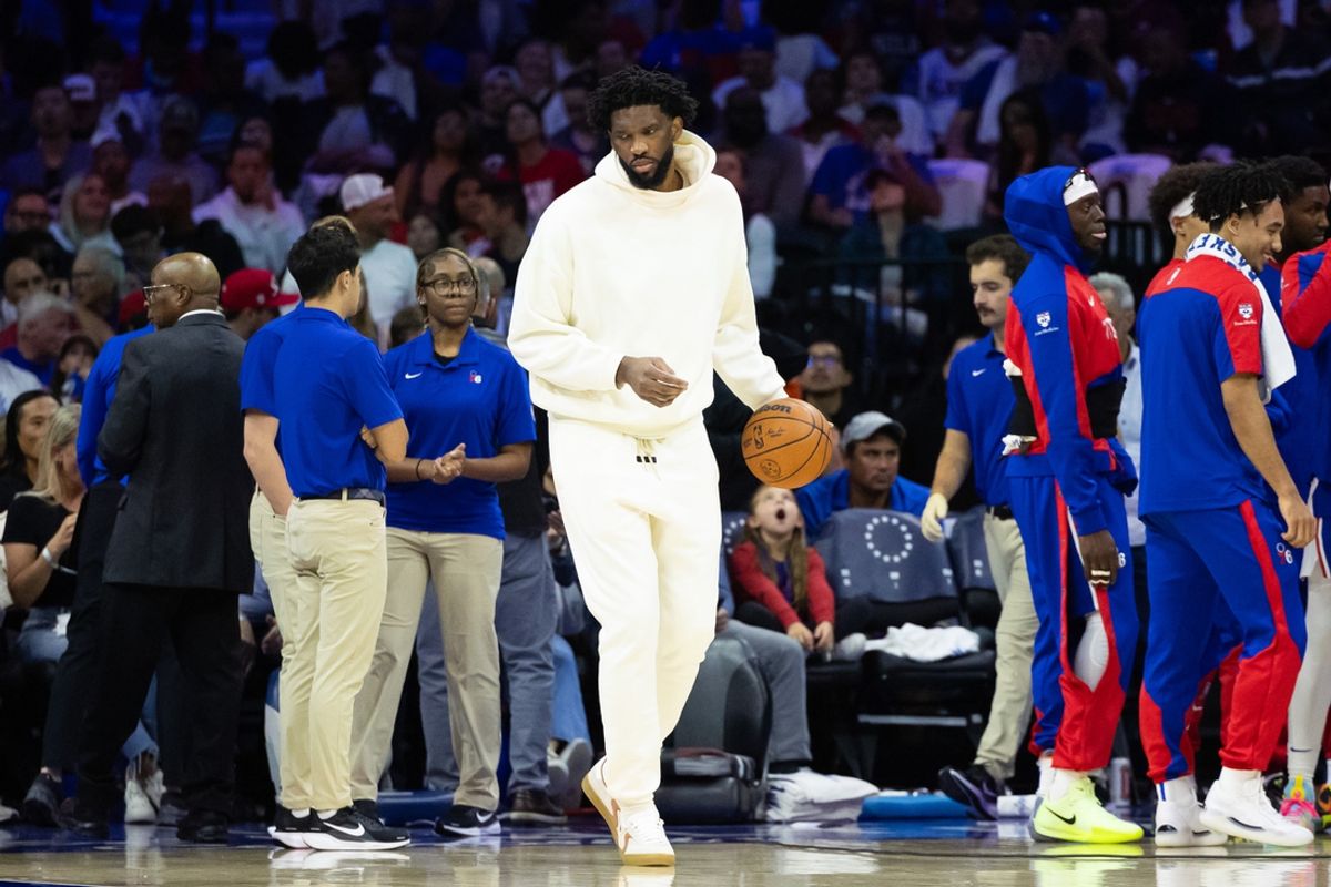 Oct 23, 2024; Philadelphia, Pennsylvania, USA; Philadelphia 76ers center Joel Embiid  in plain clothes dribbles the ball during a timeout in the second quarter against the Milwaukee Bucks at Wells Fargo Center. Mandatory Credit: Bill Streicher-Imagn Images