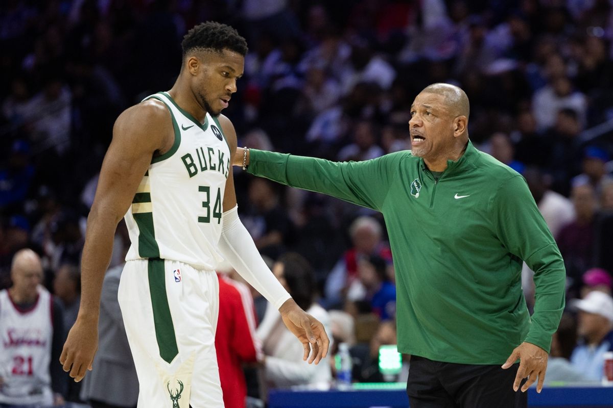 Oct 23, 2024; Philadelphia, Pennsylvania, USA; Milwaukee Bucks head coach Doc Rivers talks with forward Giannis Antetokounmpo (34) during the third quarter against the Philadelphia 76ers at Wells Fargo Center. Mandatory Credit: Bill Streicher-Imagn Images